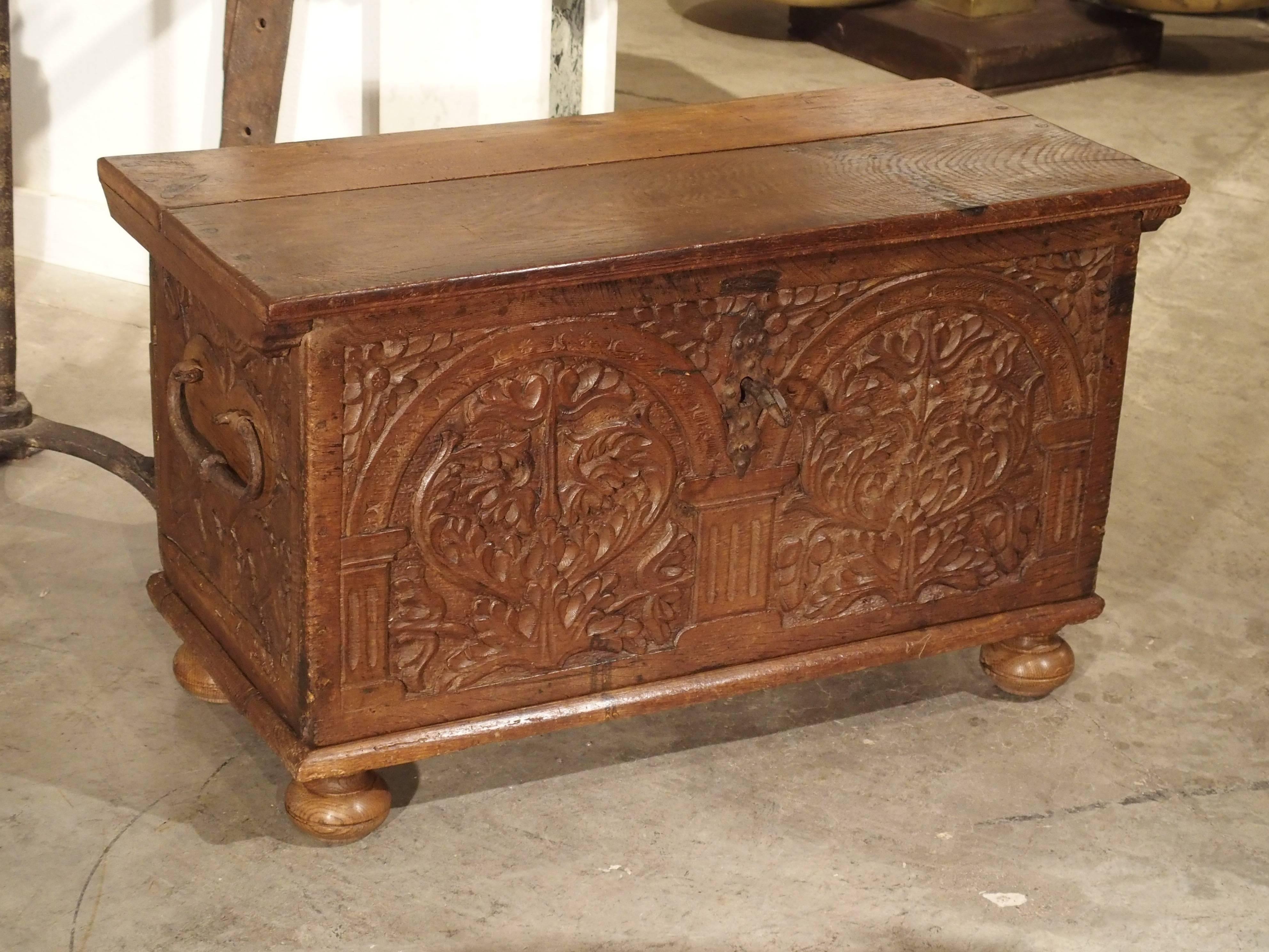 Wrought Iron 17th Century Carved Oak Trunk with Detailed Arcading and Foliate Motifs