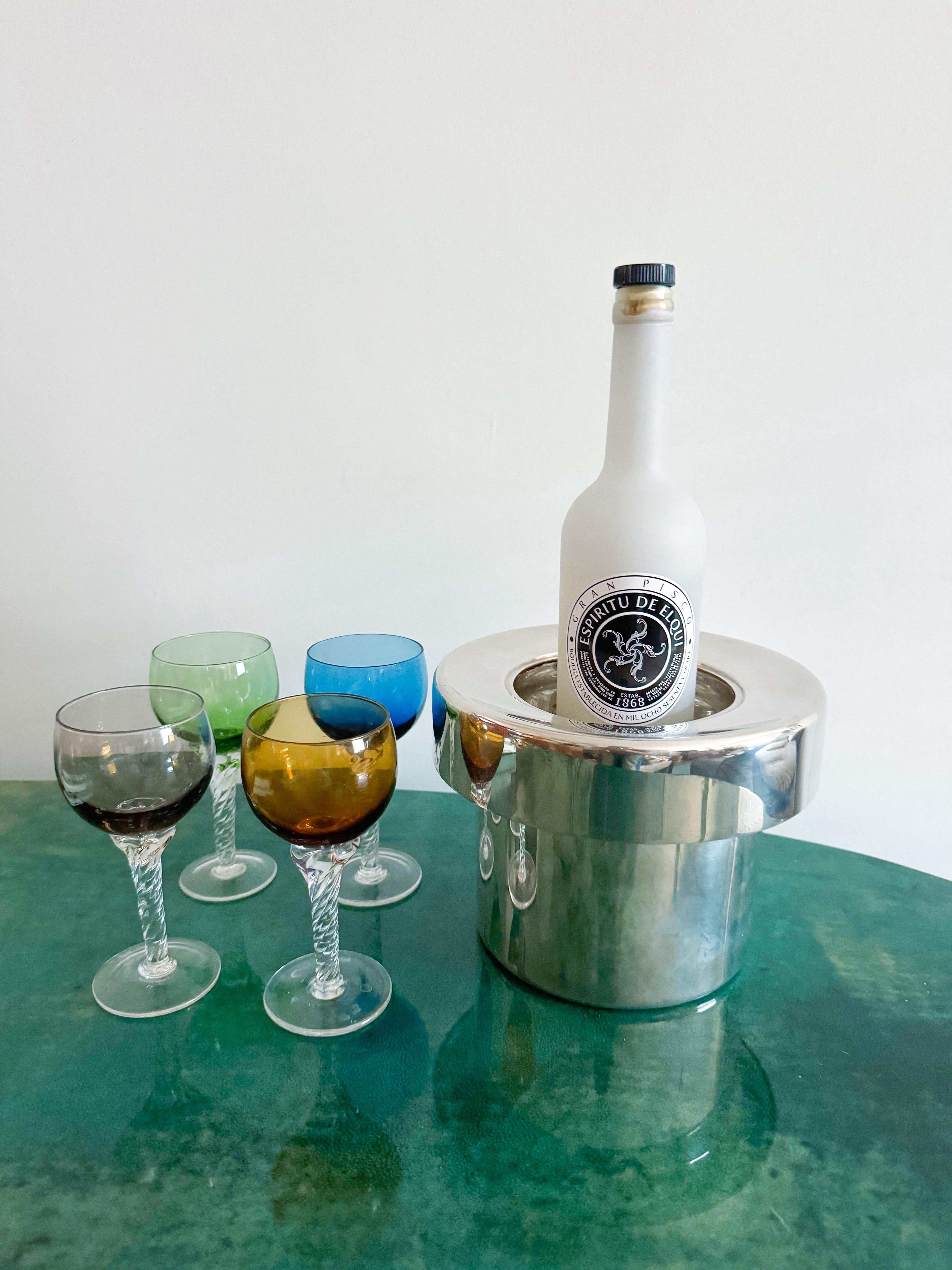 This elegant and substantial wine chiller was designed by Lino Sabattini and produced by Sabattini Argenteria in Italy during the 1970s. Crafted from silver-plated brass, the piece features a bold cylindrical silhouette with a wide, flat rim that