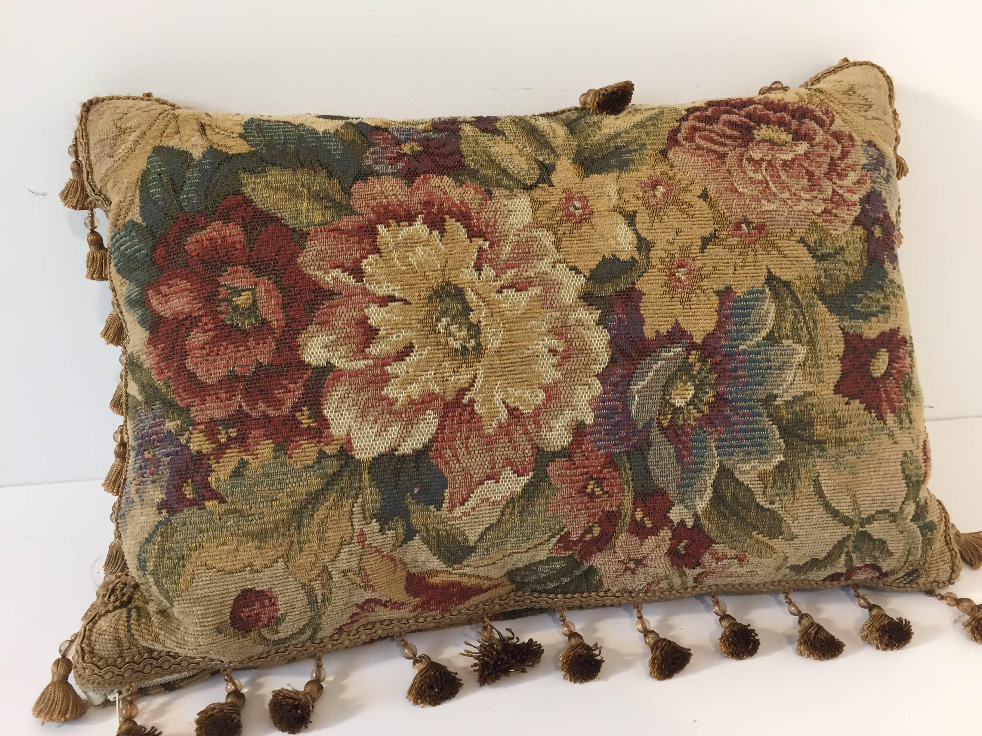 French antique throw pillow with floral design.
The pillow is made from an antique Aubusson tapestry, with trims and tassels.
Measures: 18