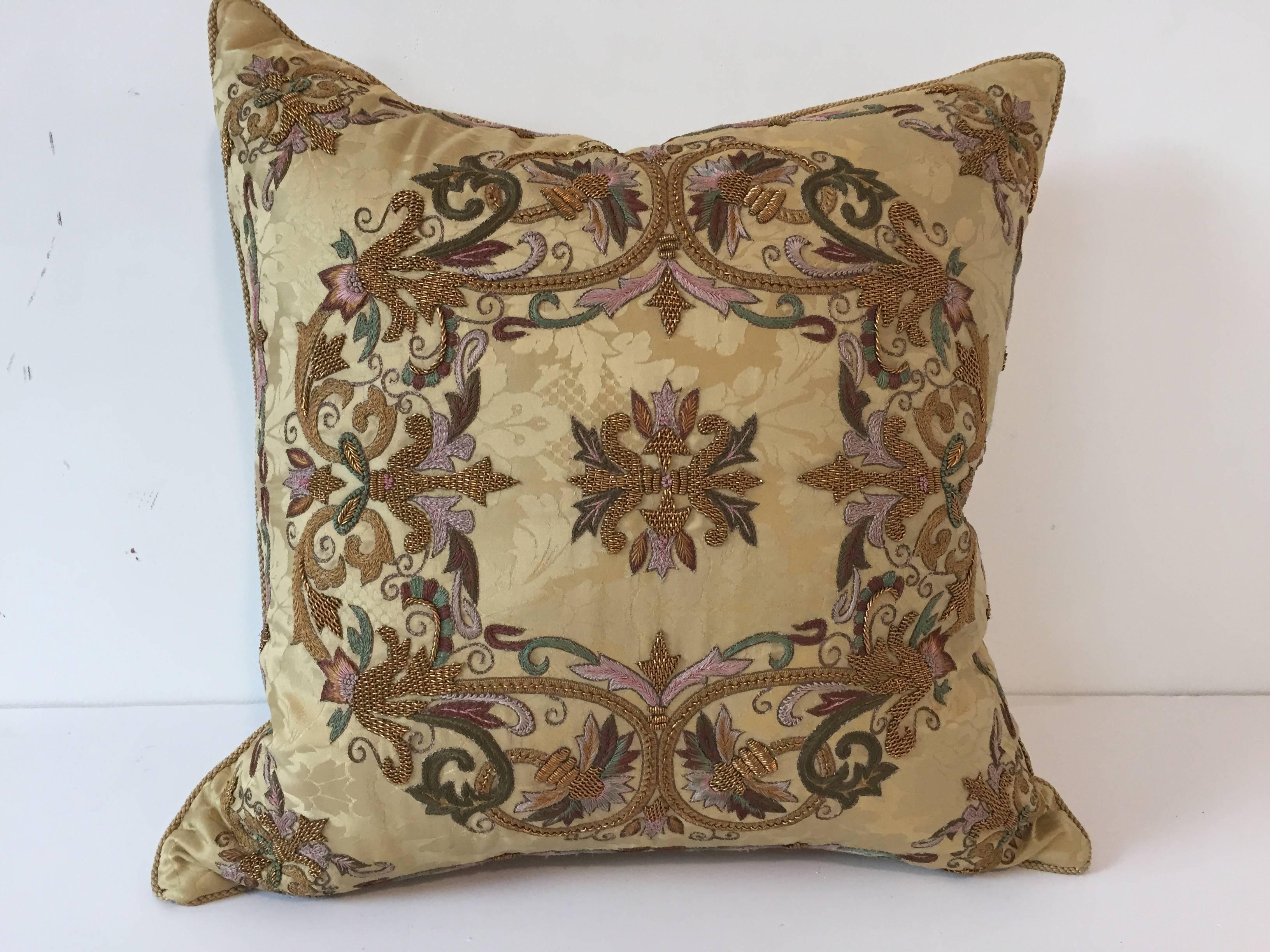 Elegant pair of designer throw pillows, satin embroidered with metal gold thread and polychrome embroideries.
By textile designer Gerry Nichol Inc New York.
Down pillow insert.
Size: 20 in. x 20 in.