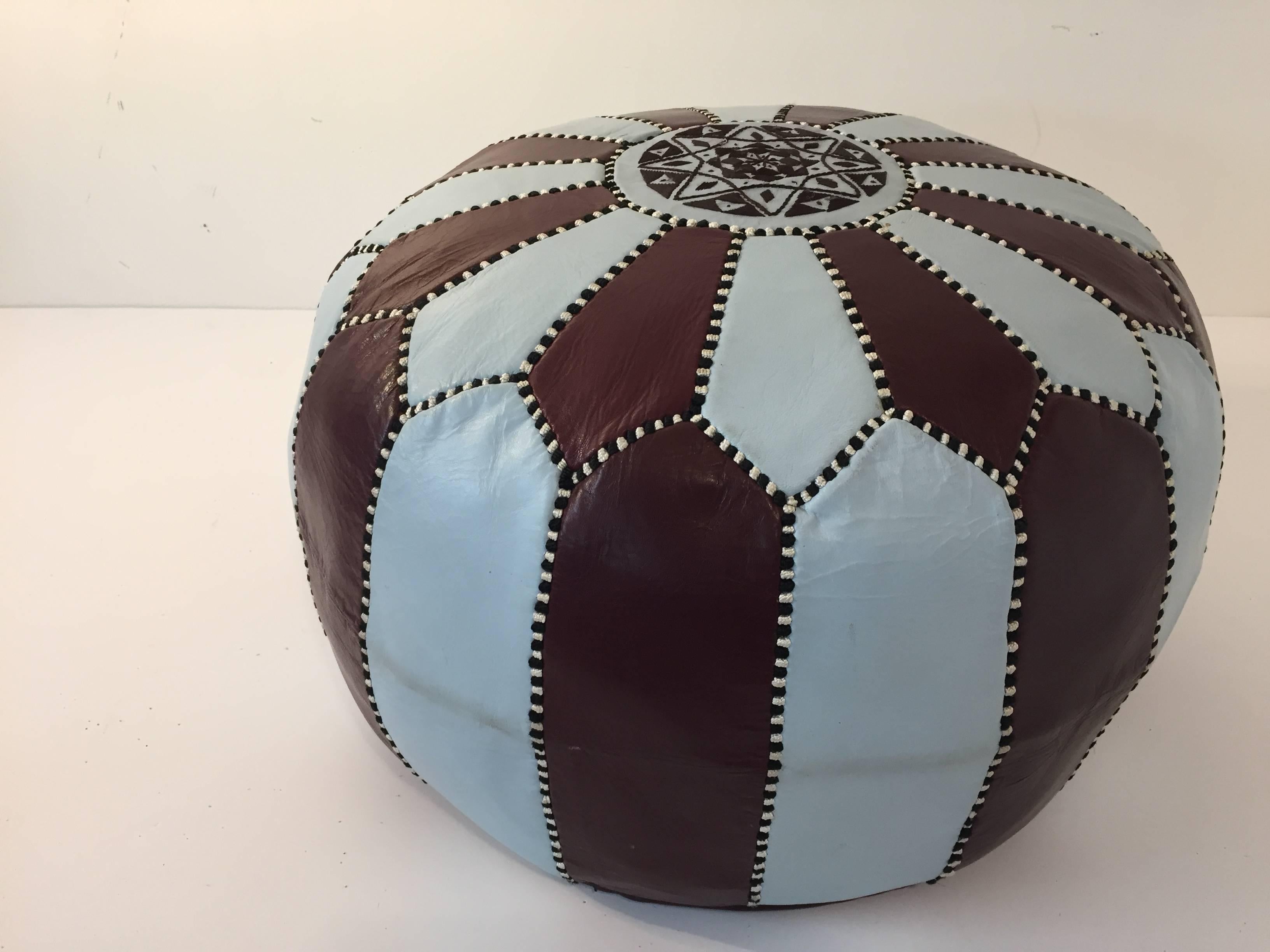 Vintage Moroccan round leather pouf brown and blue embroidered with the eight pointed star on top.
Handcrafted by artisans in Morocco, 
circa 1970s.