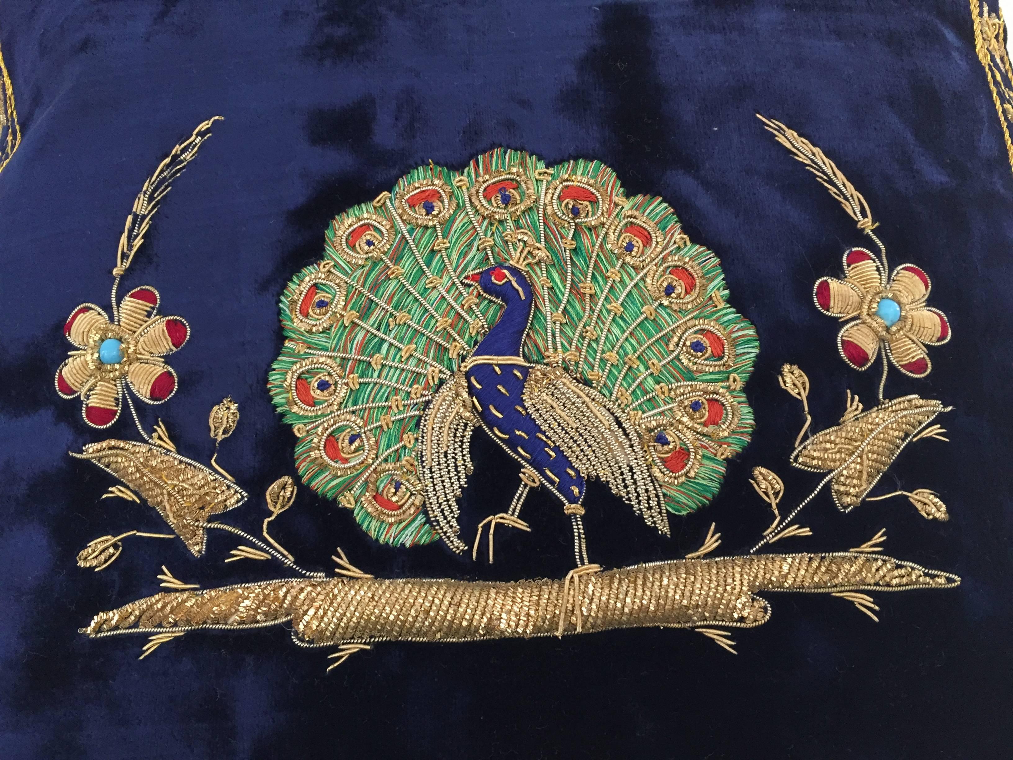 Velvet midnight blue silk pillow hand embroidered with gold threads and sequins depicting a royal peacock on a branch.
Gold, green, indigo blue and ruby red with turquoise pearl.
One of a kind handcrafted throw pillow.
Silk backed with zipper.