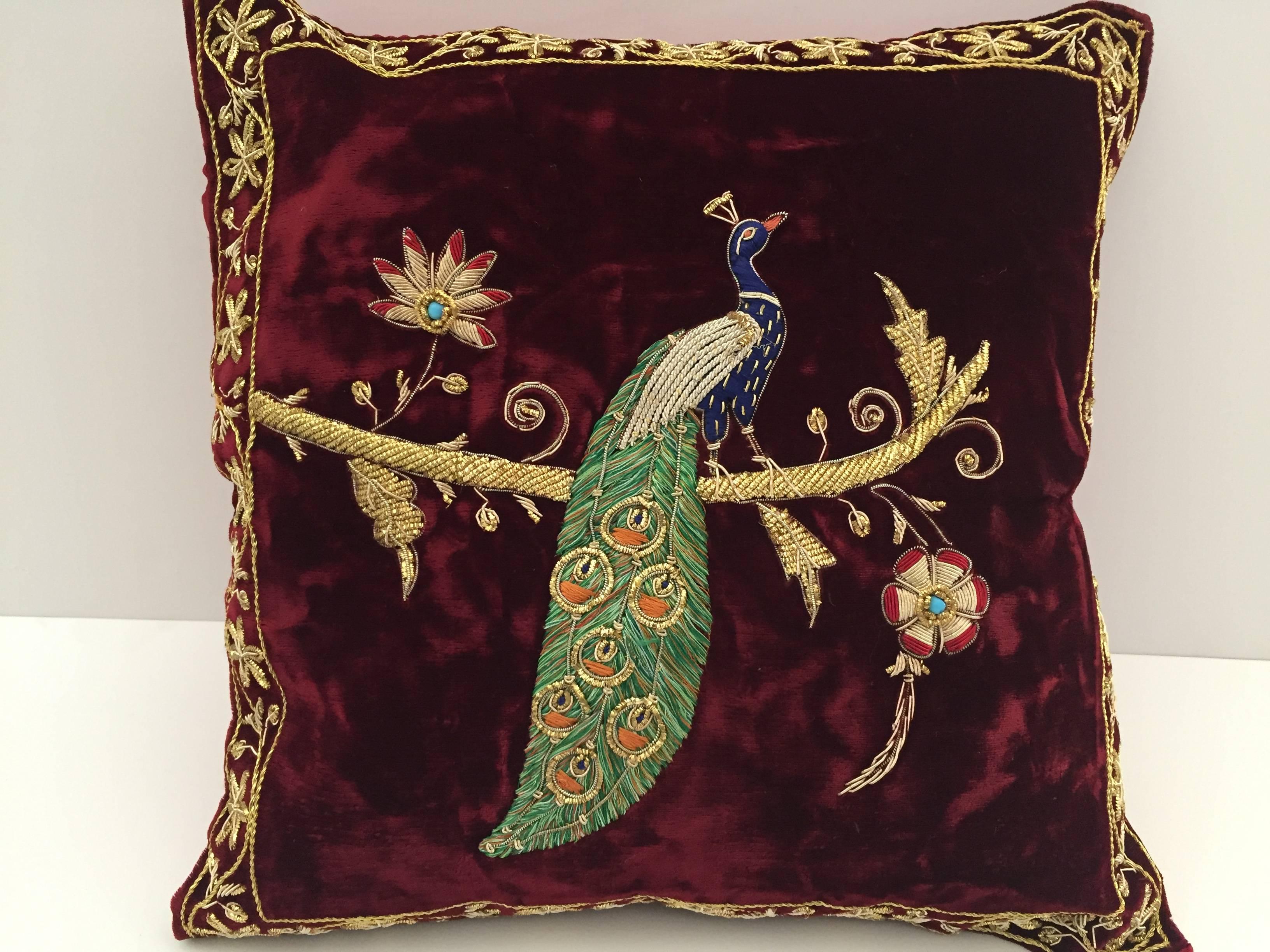 Velvet Burgundy silk pillow hand embroidered with gold threads and sequins depicting a royal peacock on a branch.
Gold, green, indigo blue and ruby red with turquoise pearl.
One of a kind handcrafted throw pillow.
Silk backed with zipper.