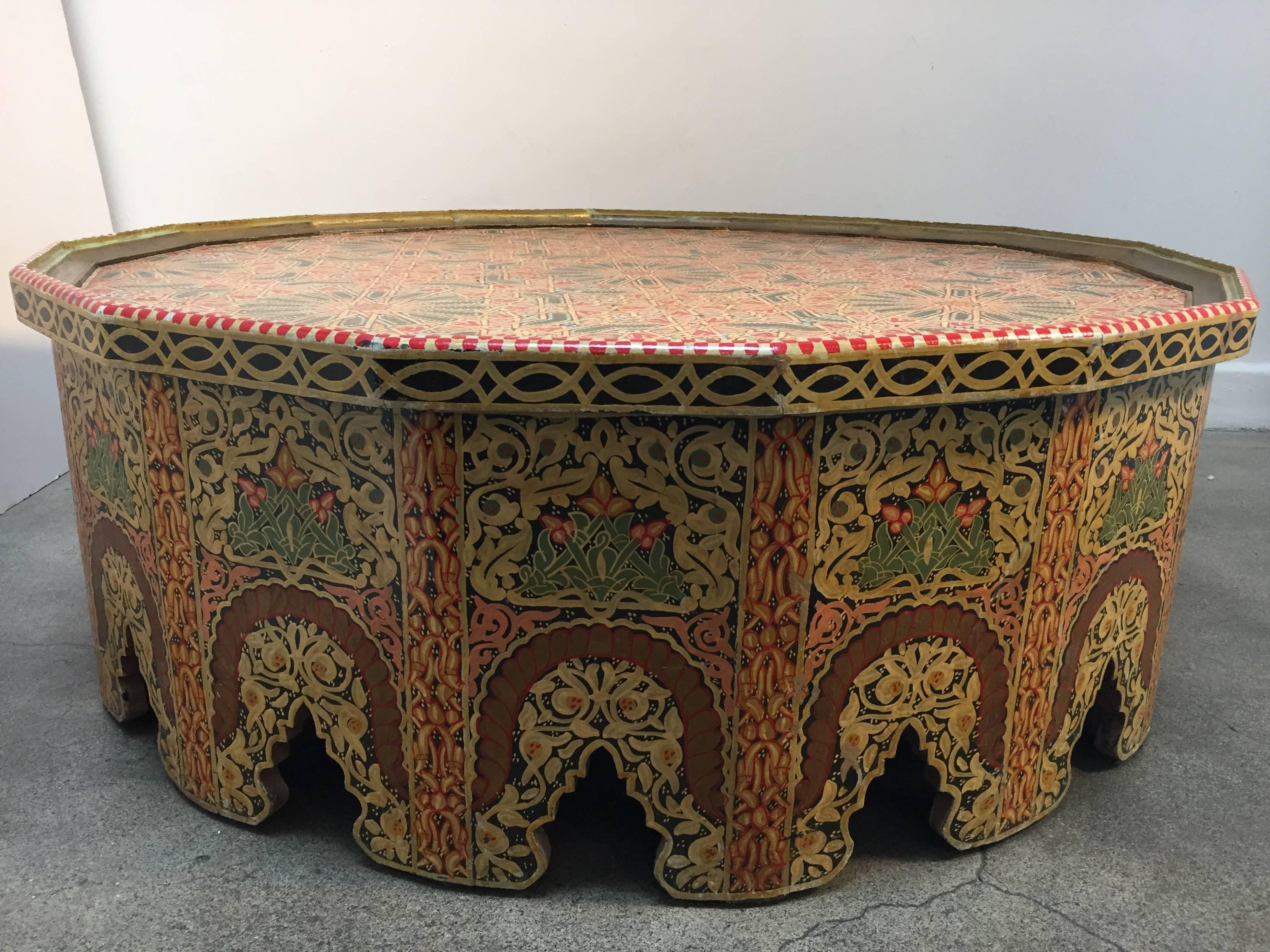 Handcrafted, hand-painted gorgeous Moroccan coffee or cocktail table. 
Polychrome with 16 sides with Moorish arches cut-out, intricate floral and geometric Fez design. 
Heavy custom-made Art and Craft table in polychrome colors, yellow, vanilla,