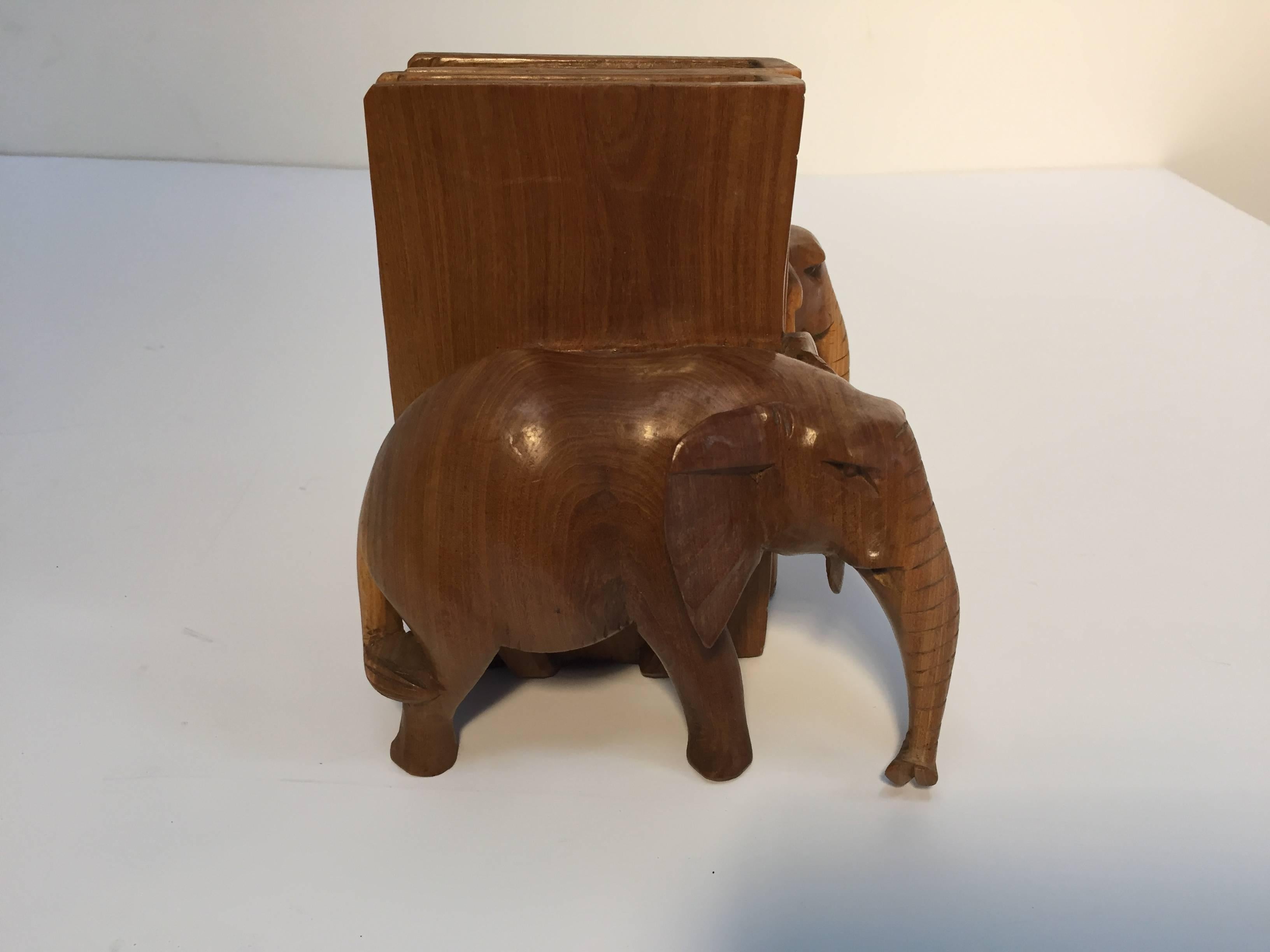 Nice pair of hand-carved wooden elephant bookends.
Elephant animal sculptures book ends handcrafted in Rajasthan, India.
Each book end is: 7.75