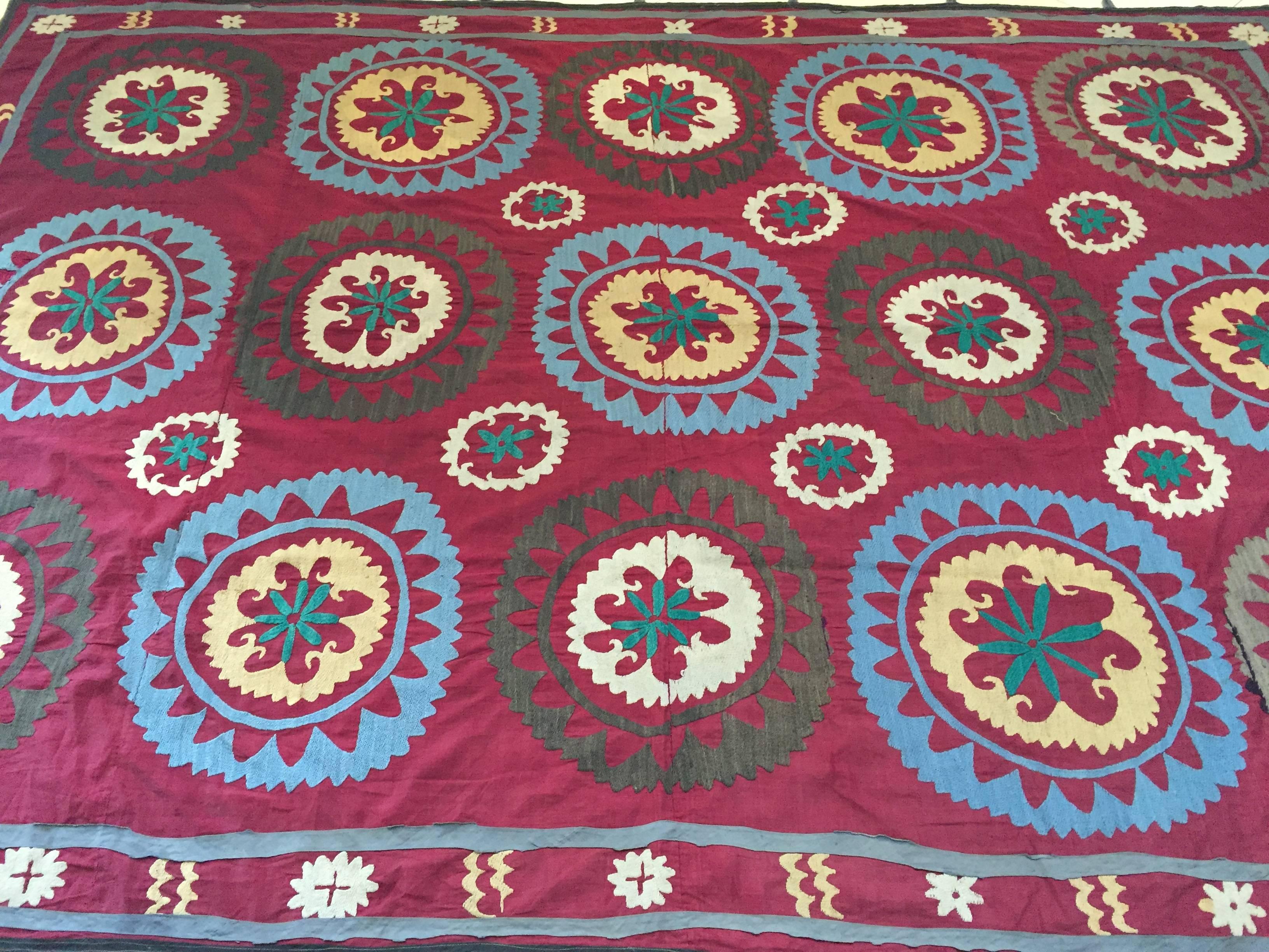 Large vintage Suzani Uzbek Samarkand textile, Suzani means needlework and these embroideries are some of the most characteristic forms of textile art from Central Asia.
A beautiful old Turkish embroidered Suzani textile from Uzbekistan. 
The motifs