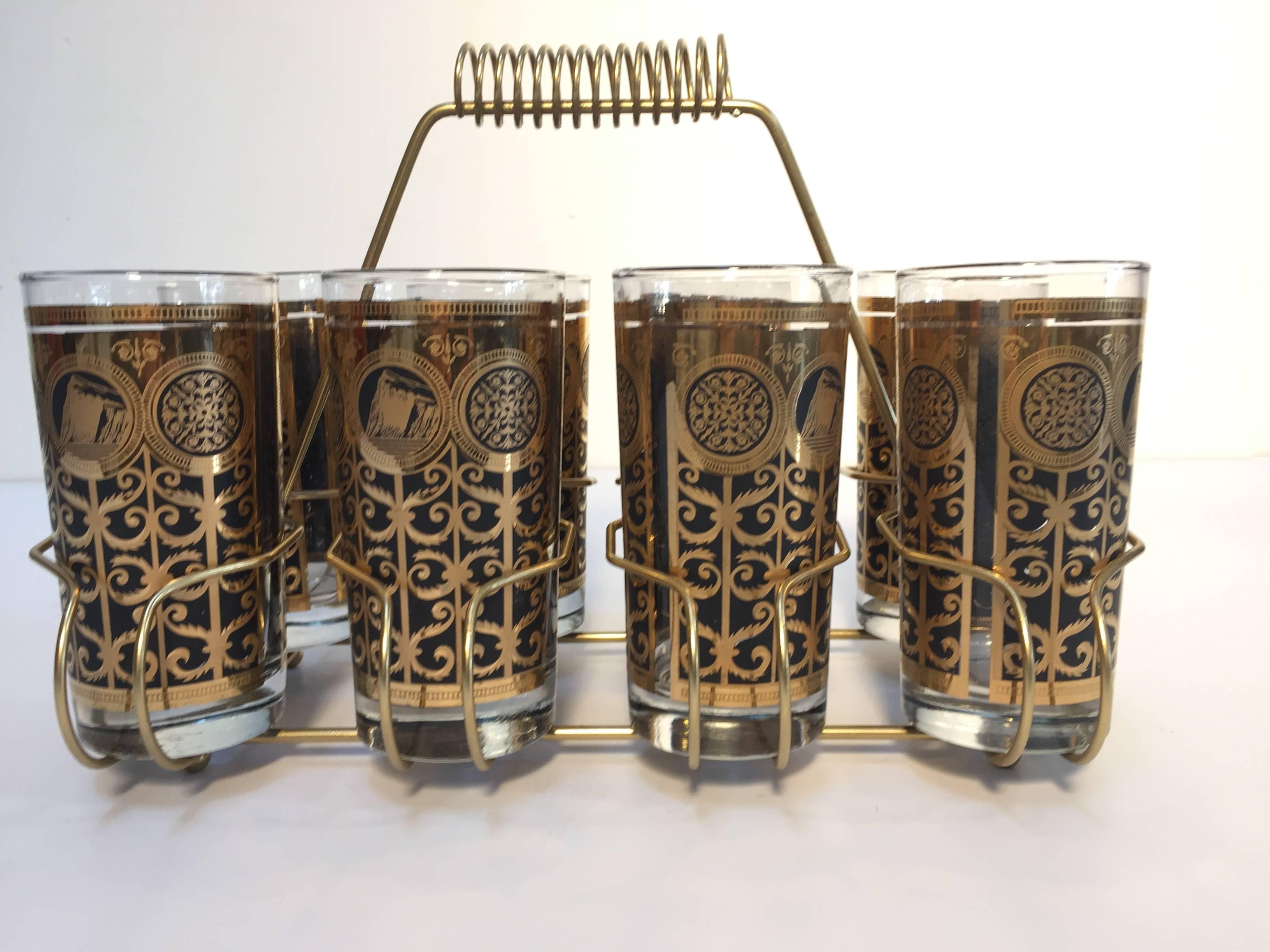 Elegant exquisite vintage set of eight Collins glasses designed by Fred Press.
Set includes eight highball glasses in a polished brass cart with handle.
The glasses are decorated with gold and black.
Perfect vintage condition, with 22-karat gold