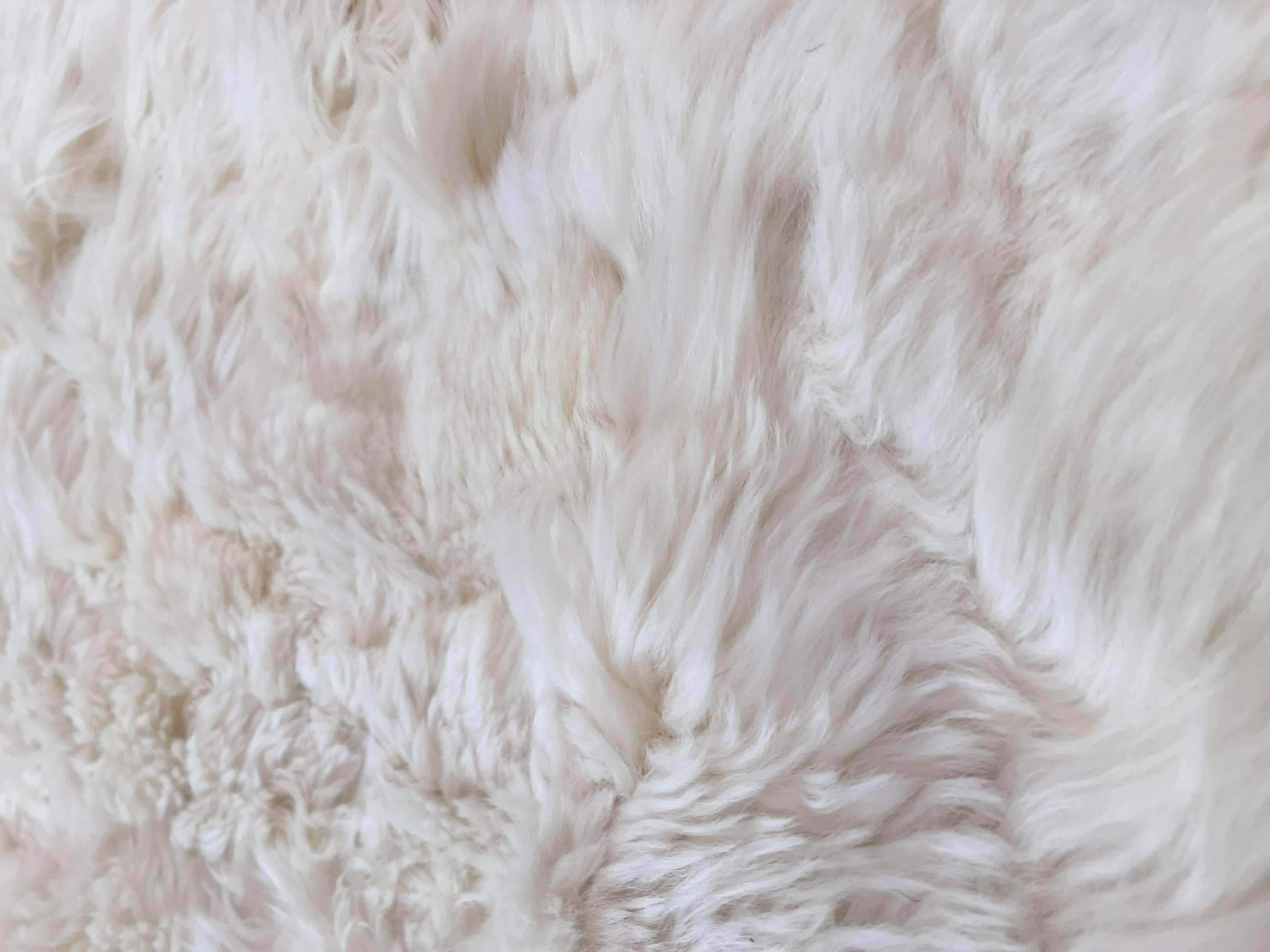 white fluffy throw rug