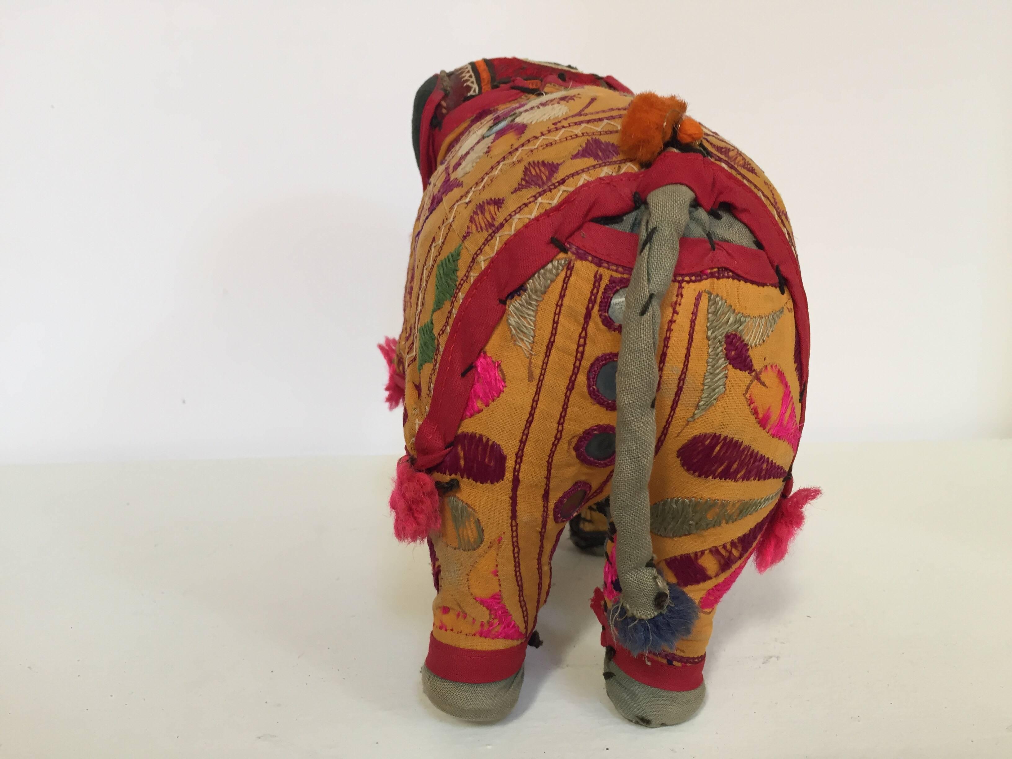 Handmade in Rajasthan, India, colorful fabric elephant toy.
Vintage small elephant stuffed cotton embroidered and decorated with small mirrors, great collector piece.
Anglo Raj, small stuffed elephant wearing the ceremonial folk attire made from