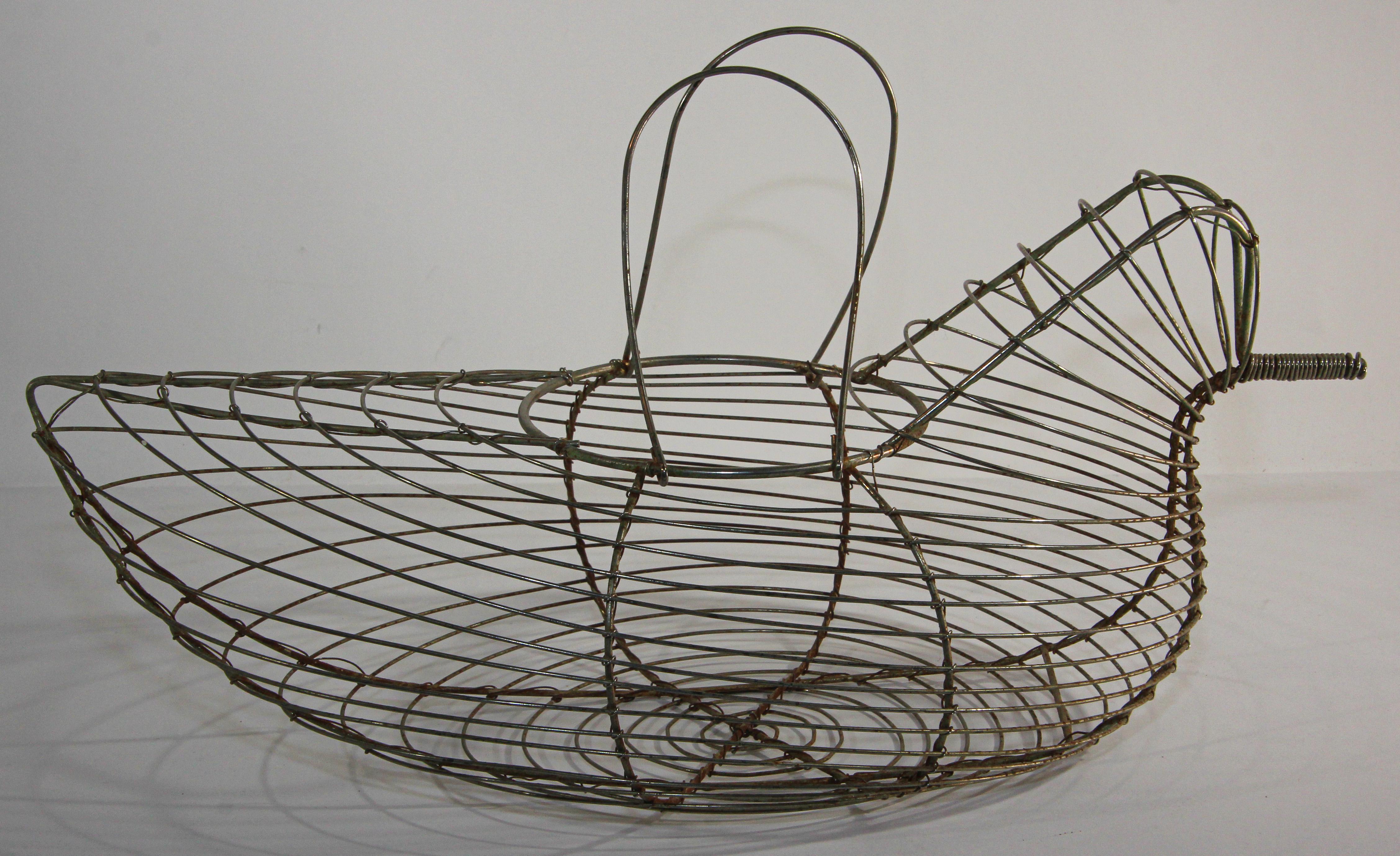 1970s or earlier vintage wire hen or chicken shaped egg basket.
Great for displaying farm fresh eggs that don't need refrigeration, all with a touch of farmhouse country flair.
It is ideal for collecting eggs, gathering vegetables from the garden,