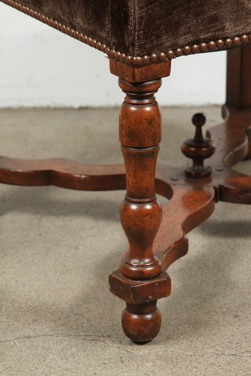 Set of 12 high back brown velvet Spanish dining chairs. Great looking with upholstered dark brown mohair velvet seats and backs with brass nail head trim details.
Walnut frames have beautifully turned legs and stretchers.    
nicely finished with