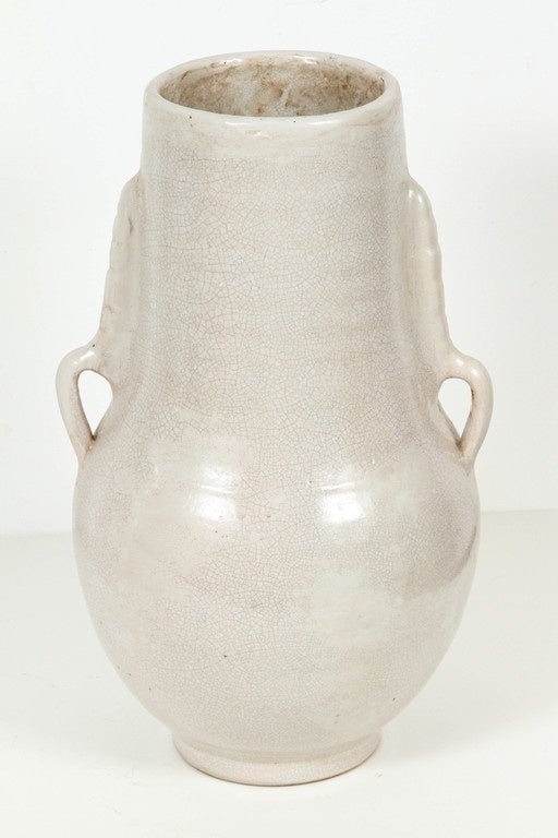 Hand-crafted Moroccan ceramic vase with handles, ivory color with different hues.
Mouth opening is 5" diameter.
This kind of ceramic Moorish Spanish style work could be found in the Alhambra palace in Spain.