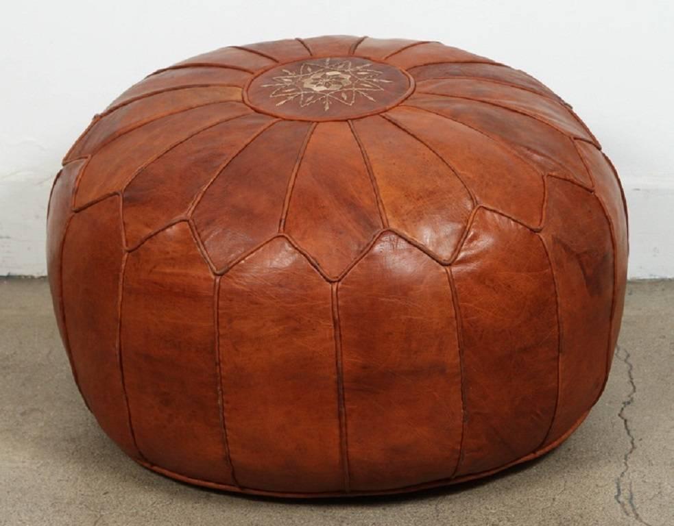 Large vintage round Moroccan leather pouf, hand-crafted in brown camel leather.
Filled with foam.
Hand tooled and embroidered on the top.
