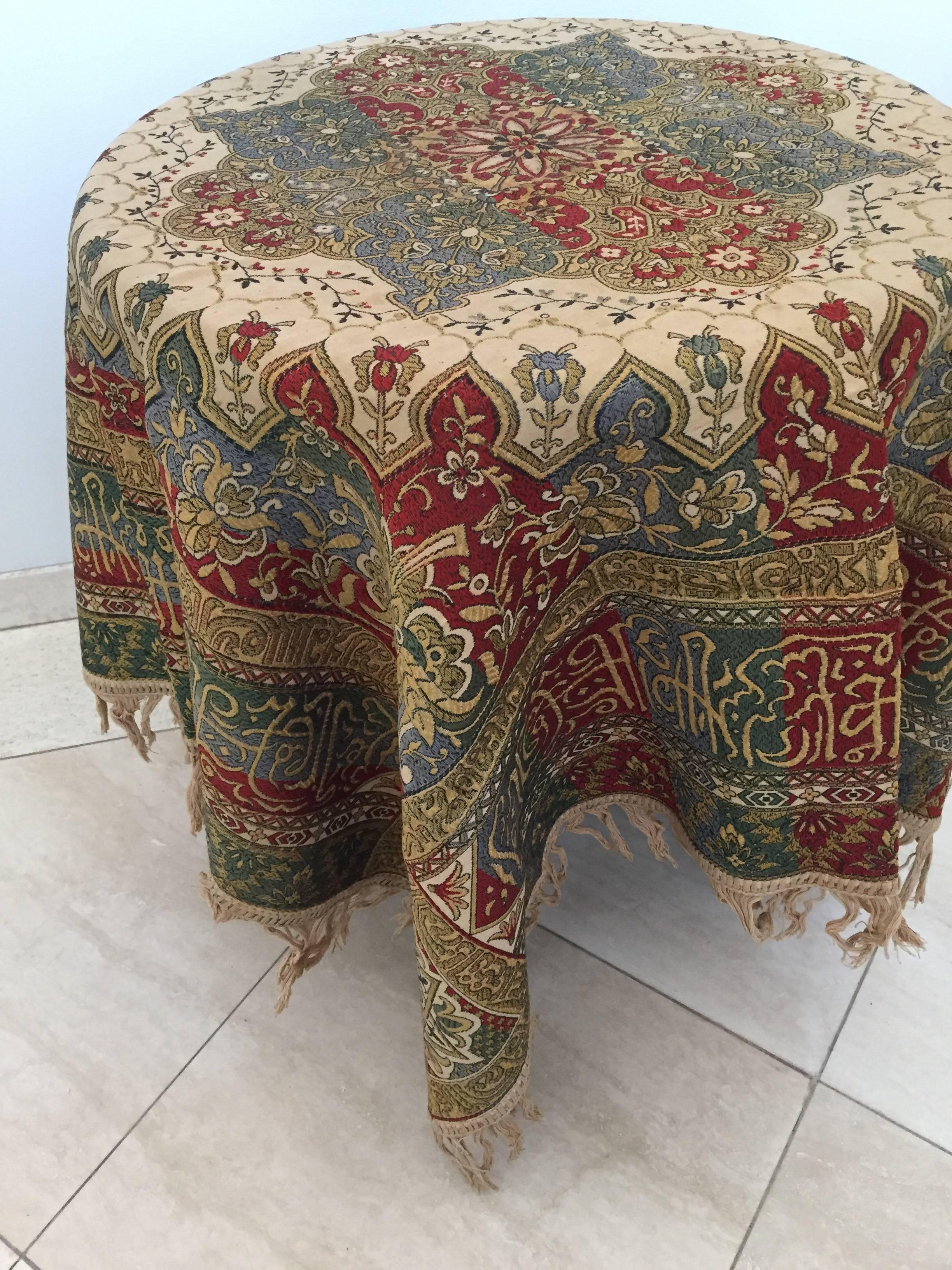 Granada, Islamic Spain, great square textile with ivory color fringes featuring Moorish floral designs and calligraphy Arabic writing.
Colors are earth tone in green, ivory and deep Moroccan red.
Could be used as a piano shawl, decorative Spanish