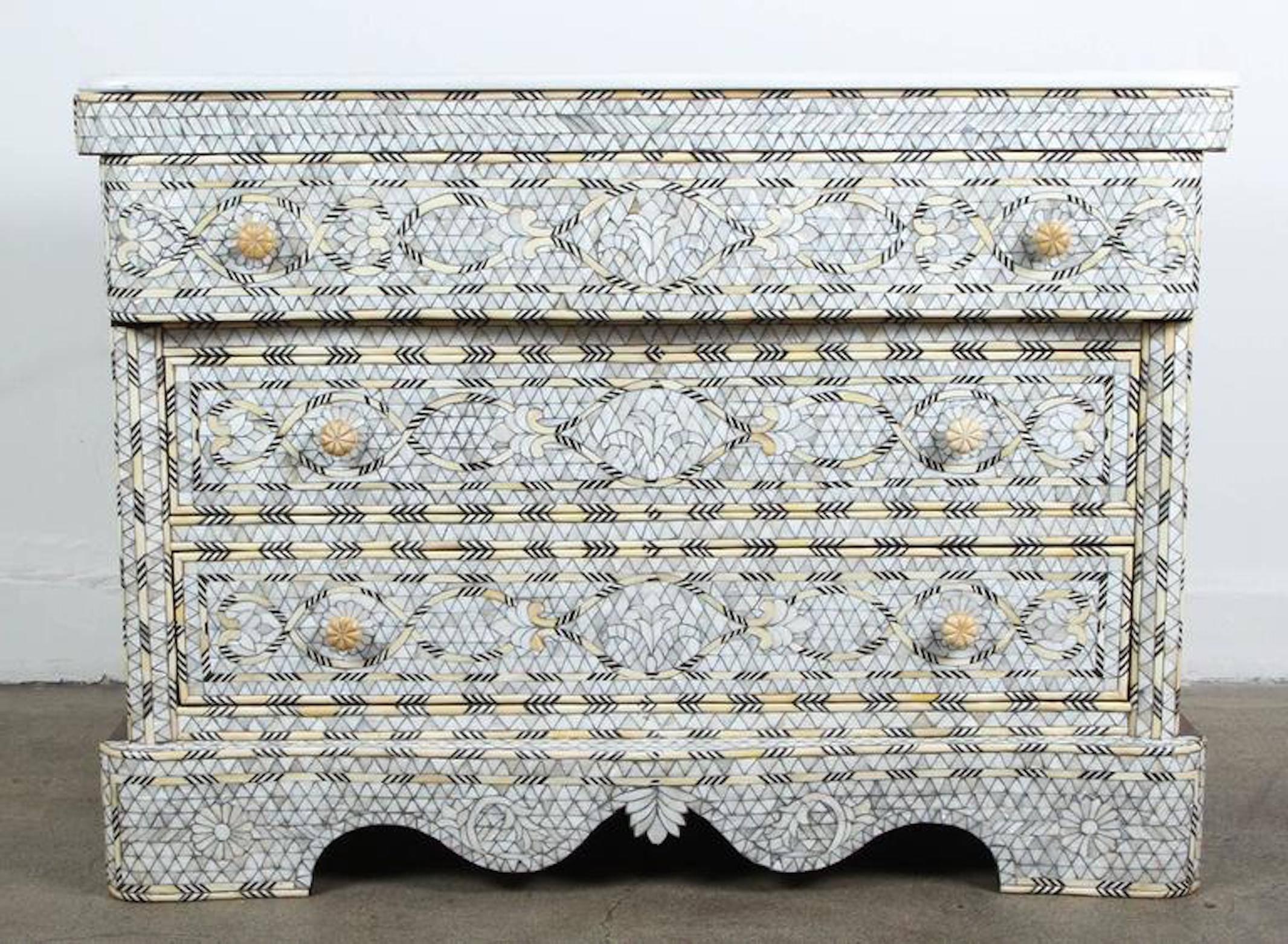 Fabulous middle Eastern Syrian artwork, handcrafted white wedding dresser with three drawers, wood inlay with mother-of-pearl, shell, ebony and bone.
Moorish arches and intricate Islamic designs.
Dowry chest of drawers heavily inlaid in front, the