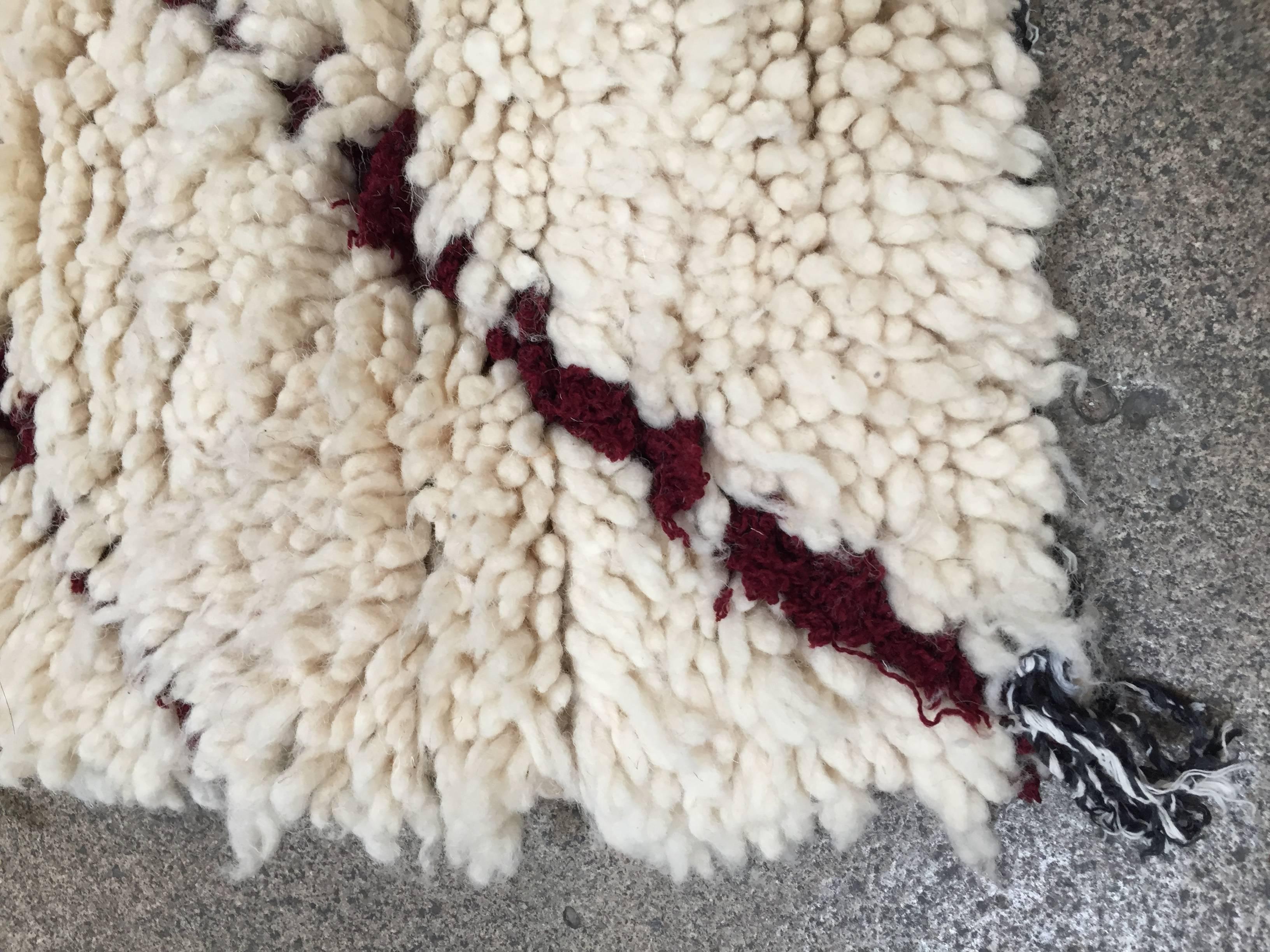 Moroccan fluffy ivory organic wool with dark lines.
Great small runner with soft natural handwoven by the Moroccan Berber women in the Atlas mountains.
Boucharouite carpet.