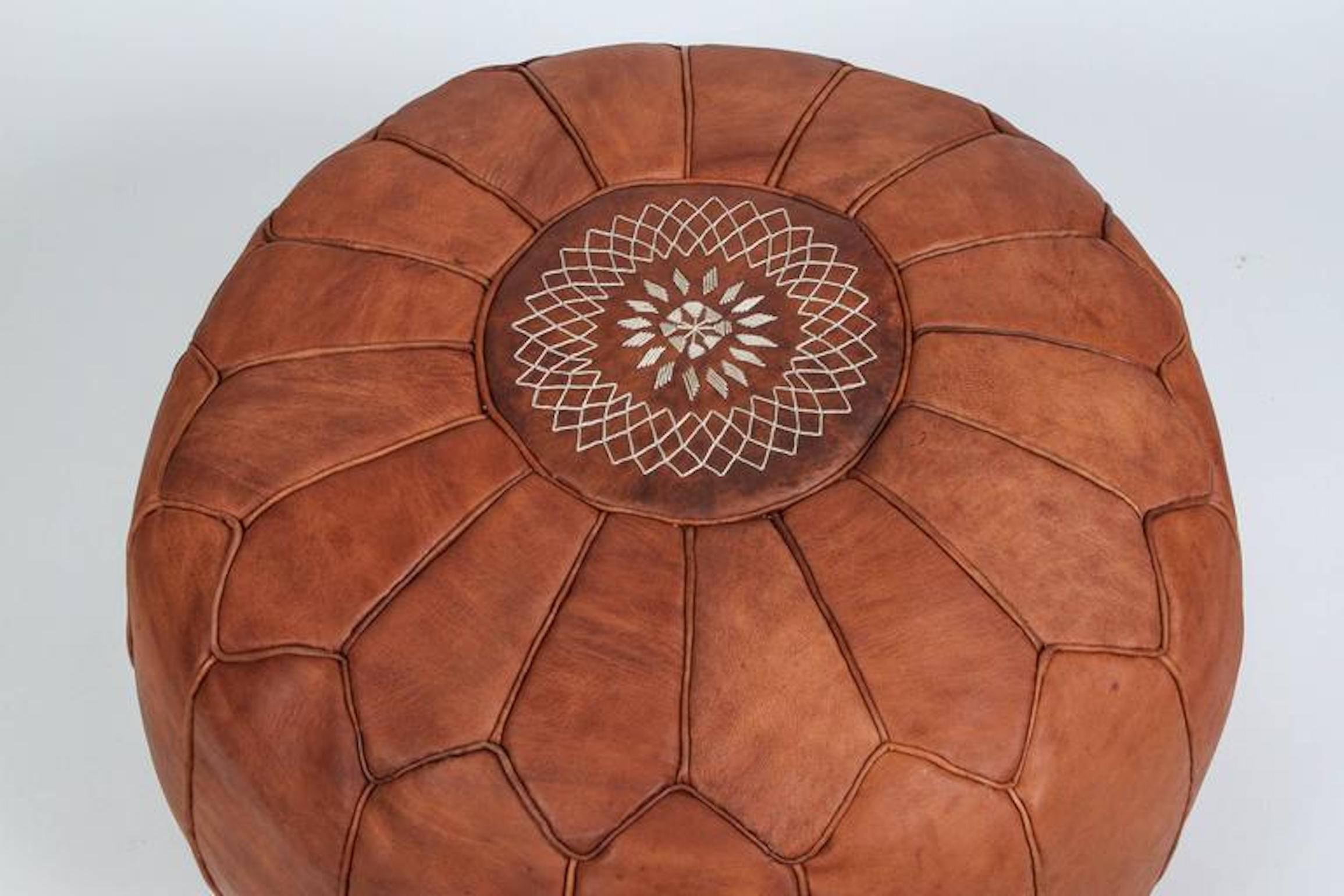 Large vintage round Moroccan leather pouf, handcrafted in brown camel leather.
Hand tooled and embroidered on the top with the Moorish star by Moroccan artisans in Marrakech.
Multiple available please contact us if you need more.
$1250 each.