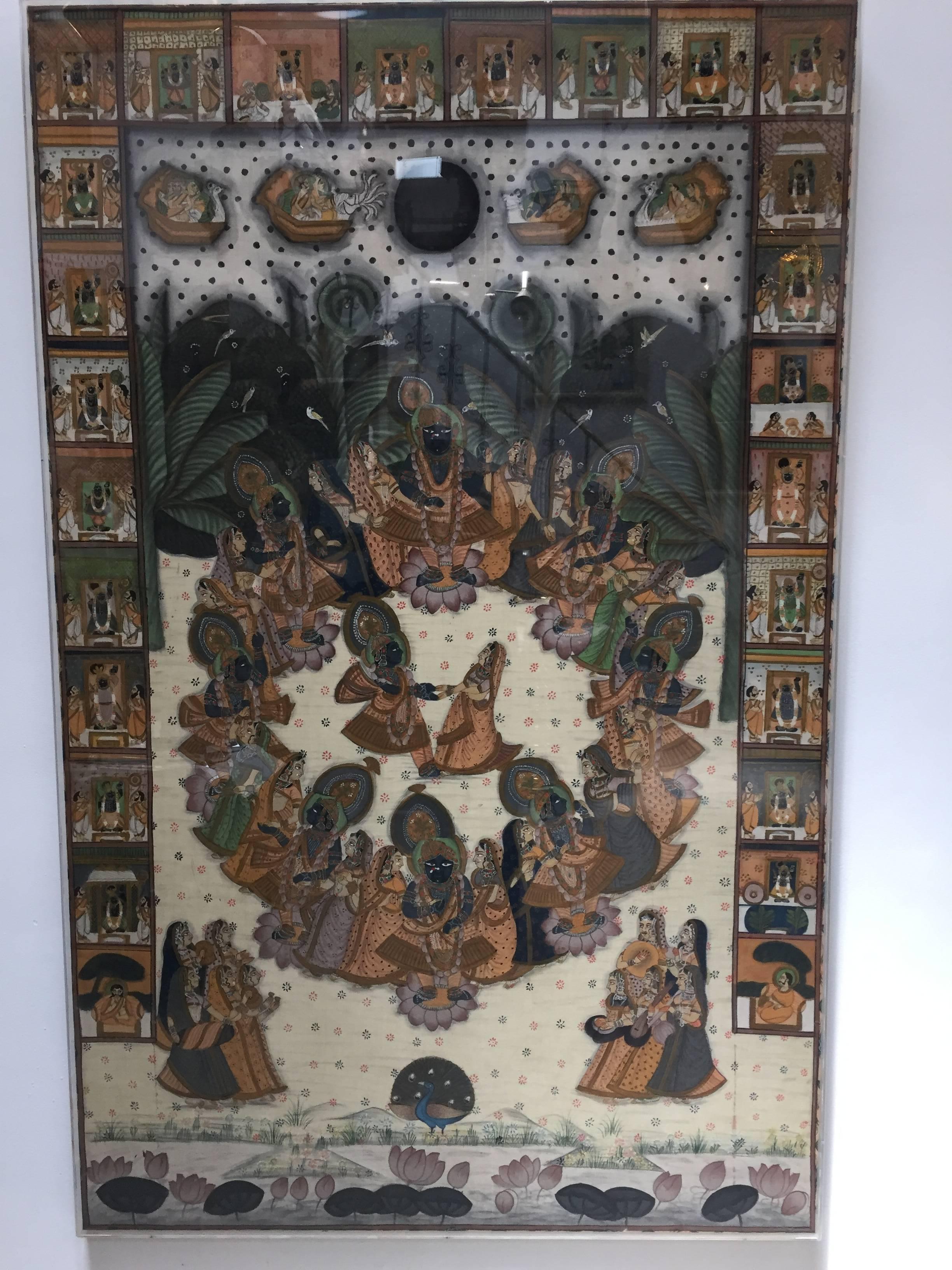 A large Pichhavai painting depicting Krishna, represented in multiple places with female Gopis dancing and offering, great colors, the composition is enclosed in a lush green forest and the colors of the dresses in oranges play off against the