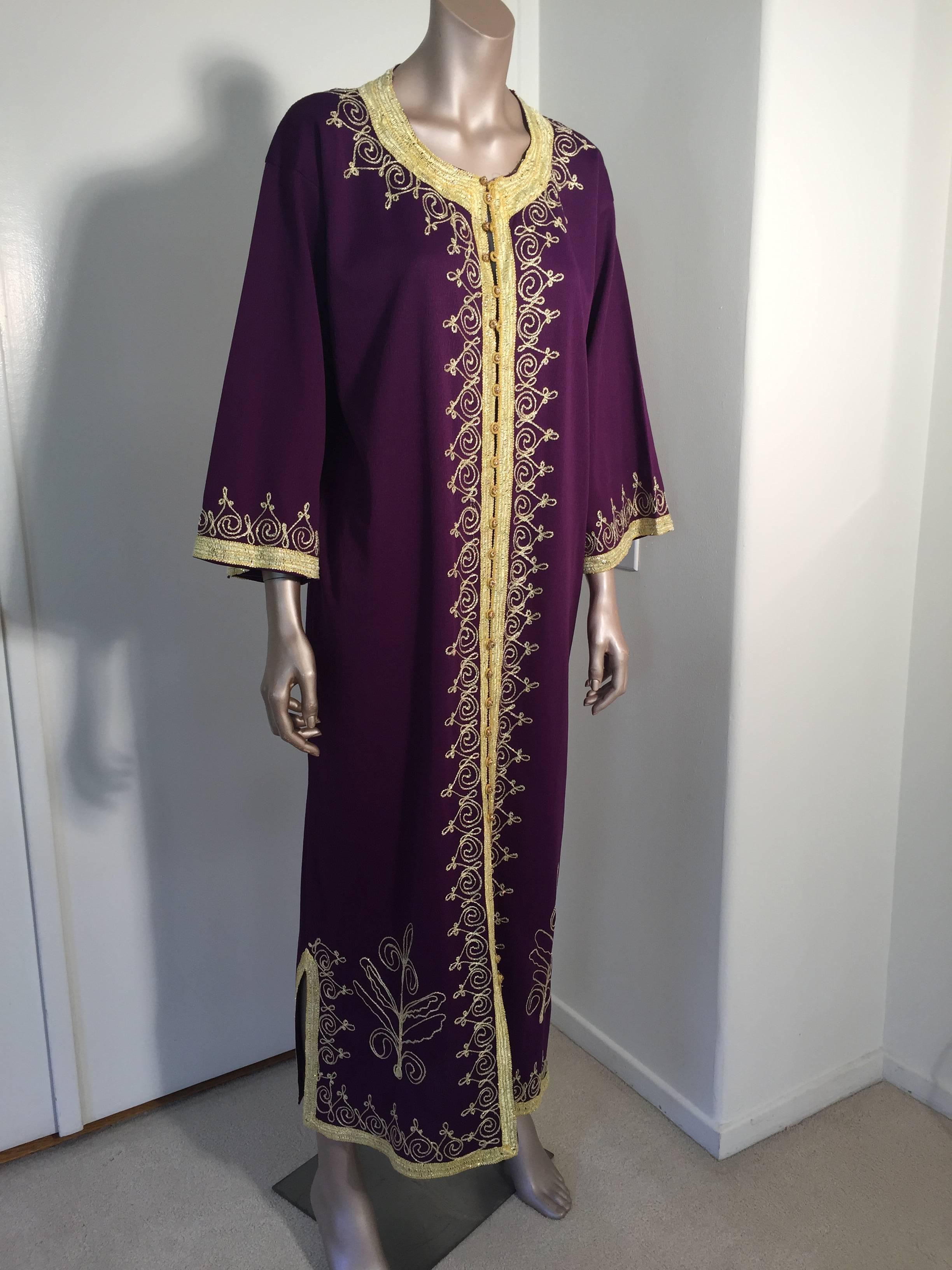 Vintage Moroccan caftan, embroidered with gold threads. 
This purple chic Gypsy Bohemian kaftan is embroidered and embellished with gold designs. 
You could wear it closed or open like a coat. 
The vintage Moorish kaftan features a traditional