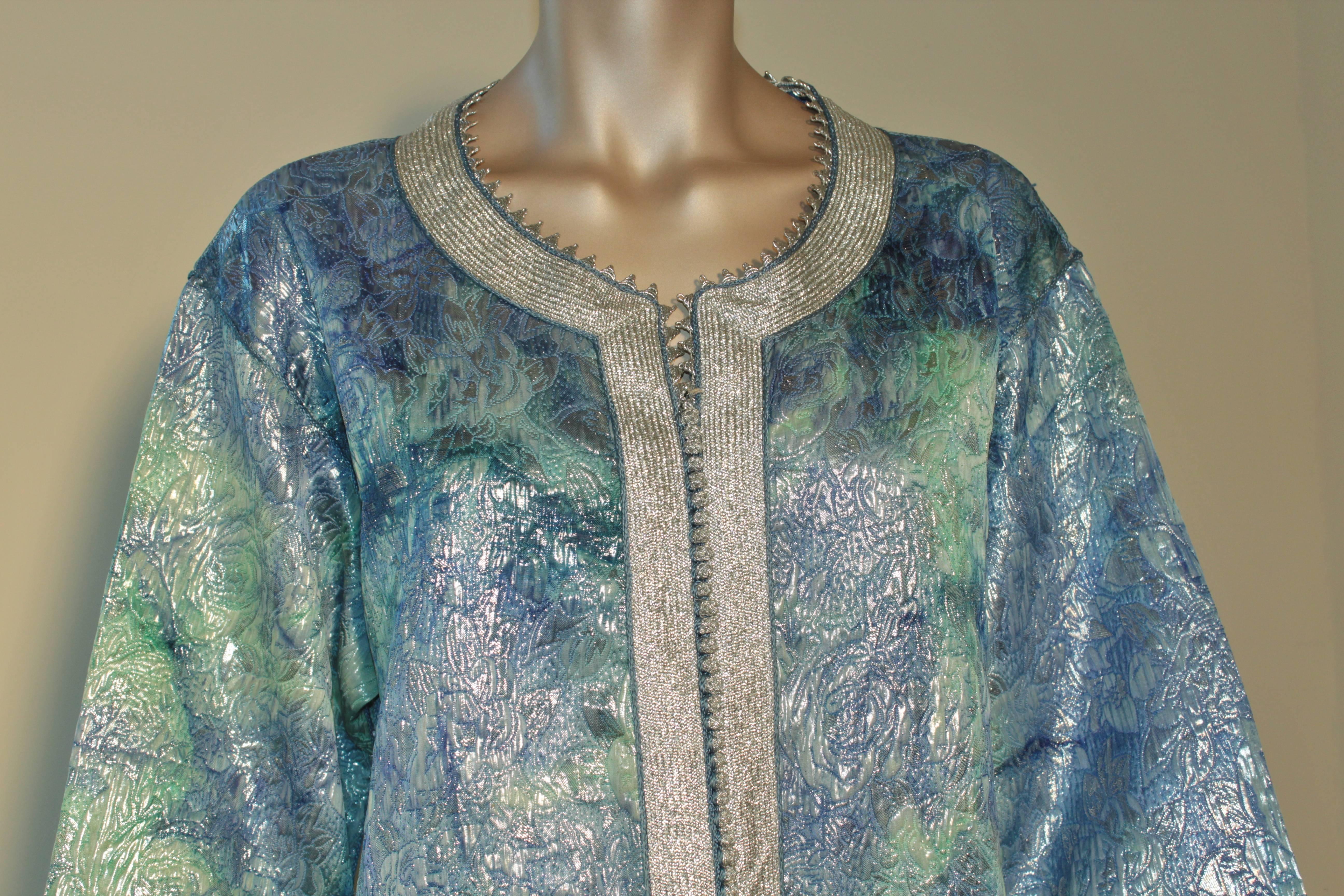 Elegant vintage Moroccan Moorish caftan. brocade metallic aquamarine blue embroidered with silver threads.
Maxi dress gown circa 1970s.
This vintage Moorish kaftan is embroidered and embellished entirely by hand.
One of a kind evening Moroccan