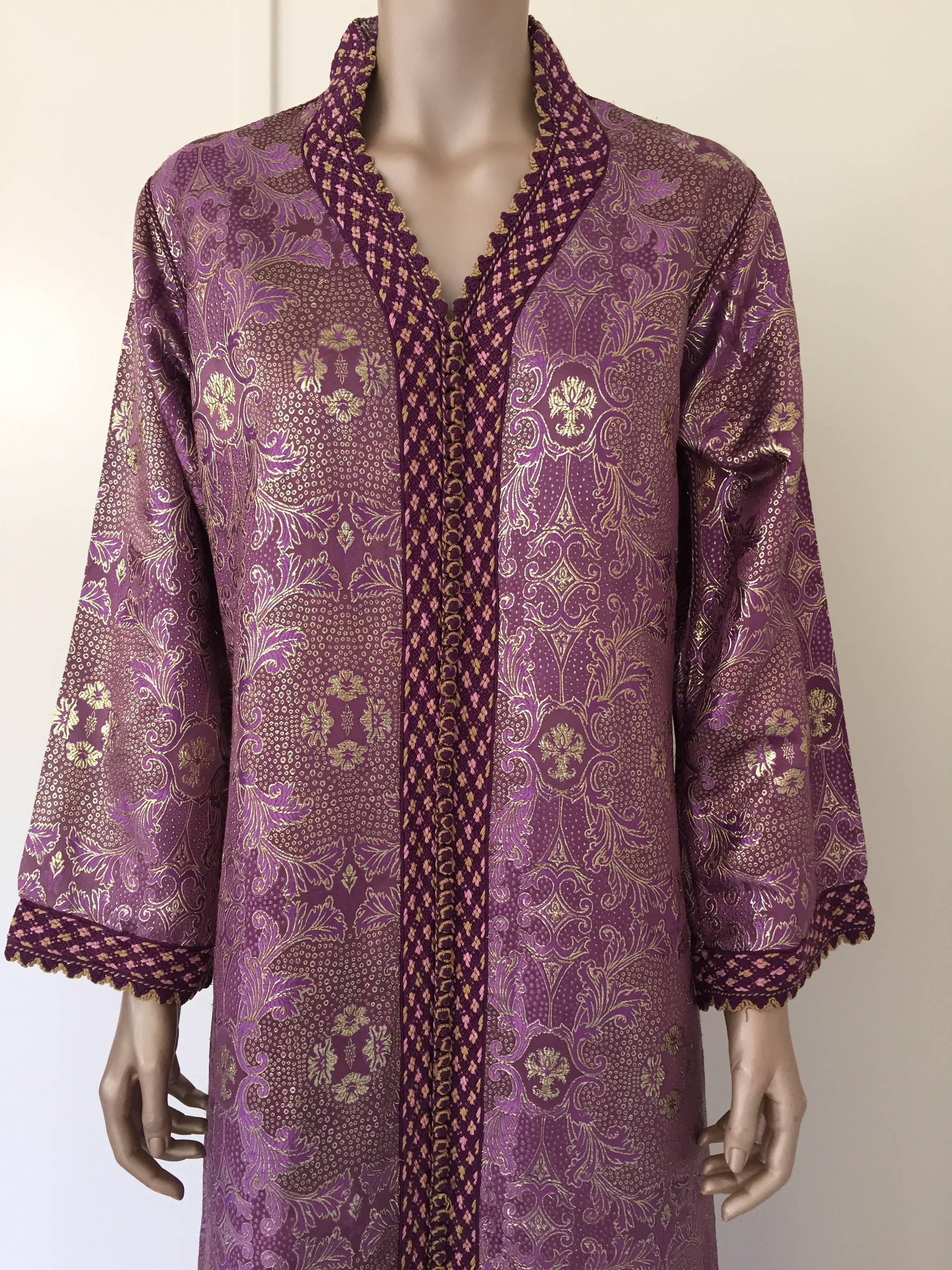 Elegant Moroccan caftan purple color lame,
circa 1980s.
This long maxi dress kaftan is embroidered and embellished entirely by hand.
One of a kind evening Moroccan Middle Eastern Royal gown.
The kaftan features a traditional neckline and embellished