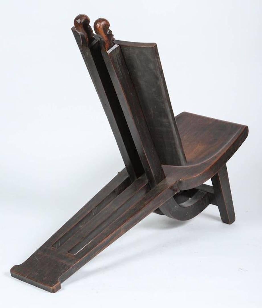 Handcrafted by reknowed African sculptor Barnabé Berquin in Katanga Elisabethville.
Very sculptural mahogany root lounge African chair. 
One of a kind African Tribal Baluba Chief’s reclining throne chair from Katanga. The high backed chair is