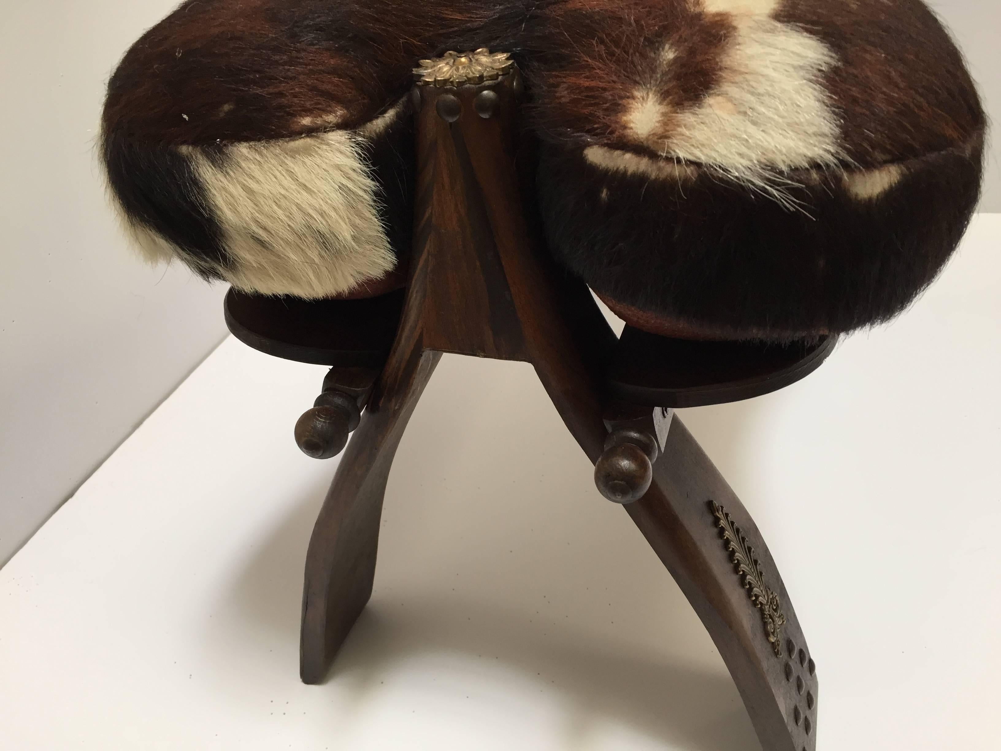 Pair of Camel Saddle Seat Footstools with Cowhide Cushions In Good Condition In North Hollywood, CA