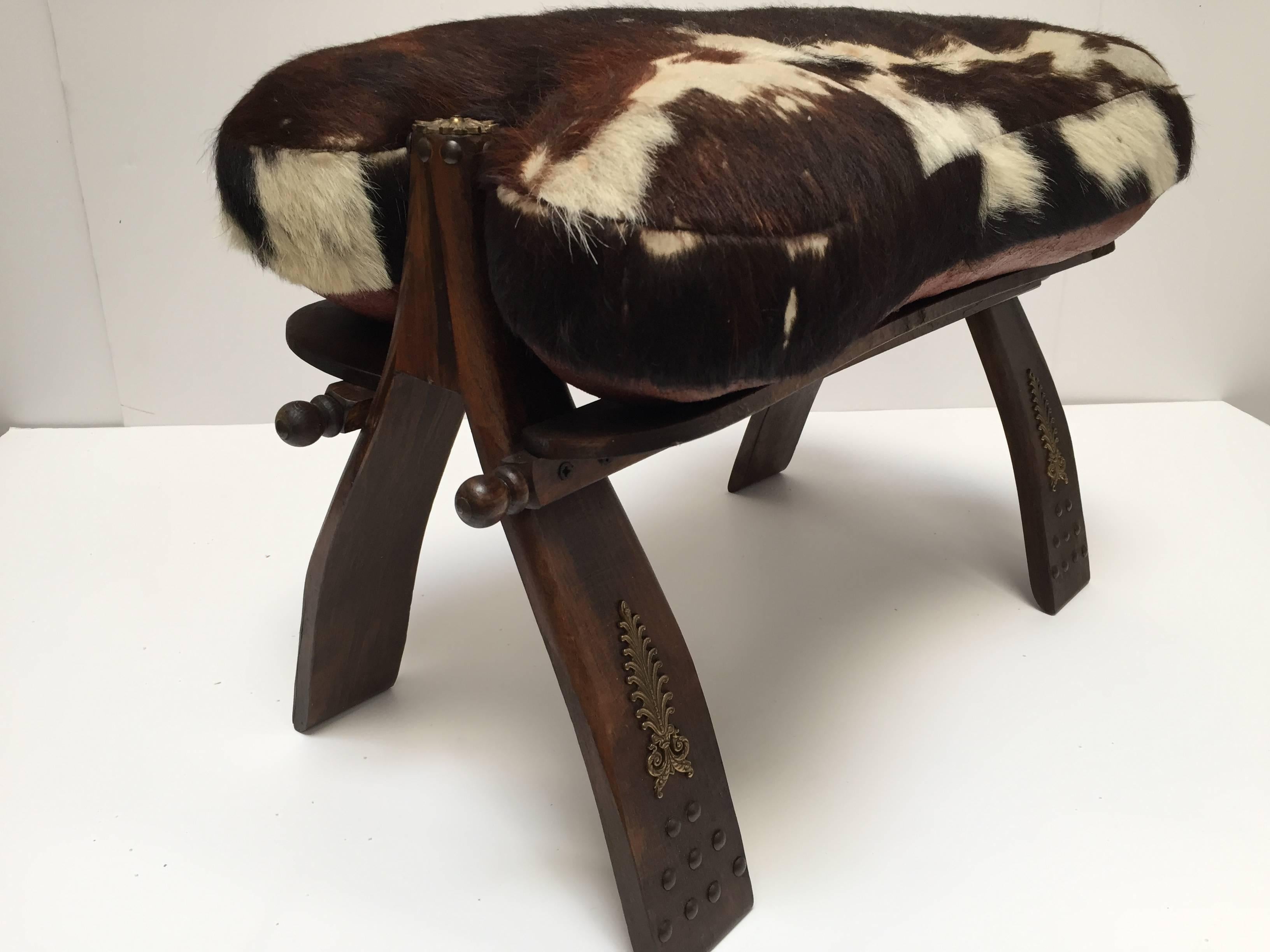 Moroccan Pair of Camel Saddle Seat Footstools with Cowhide Cushions