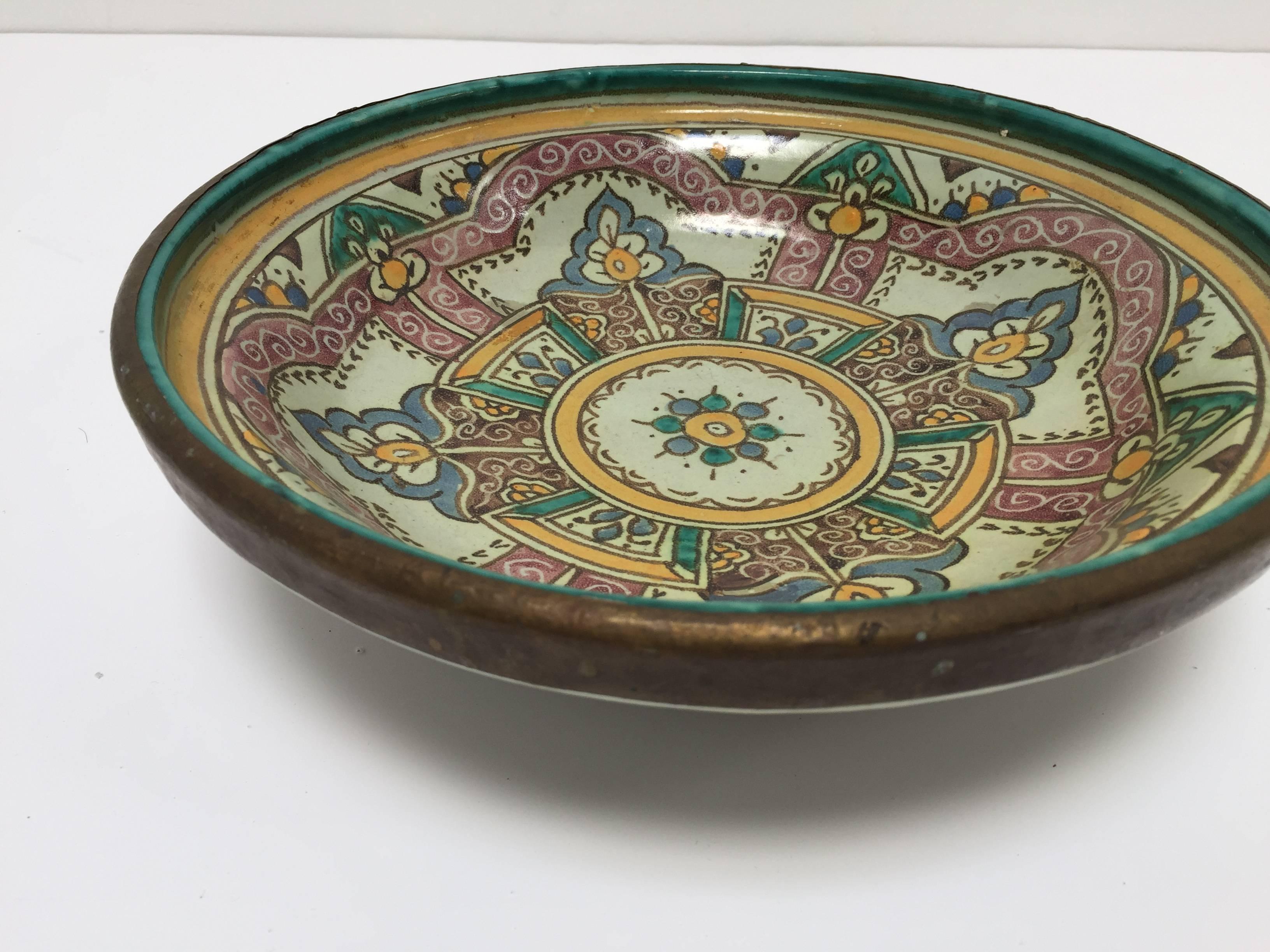 Large Moroccan Moorish ceramic bowl with brass contour handcrafted in Fez by artisans.
Hand-painted ceramic from Fez Morocco.
This kind of ceramic Moorish Spanish style work could be found at the Alhambra palace in Granada Spain.
Turquoise blue,