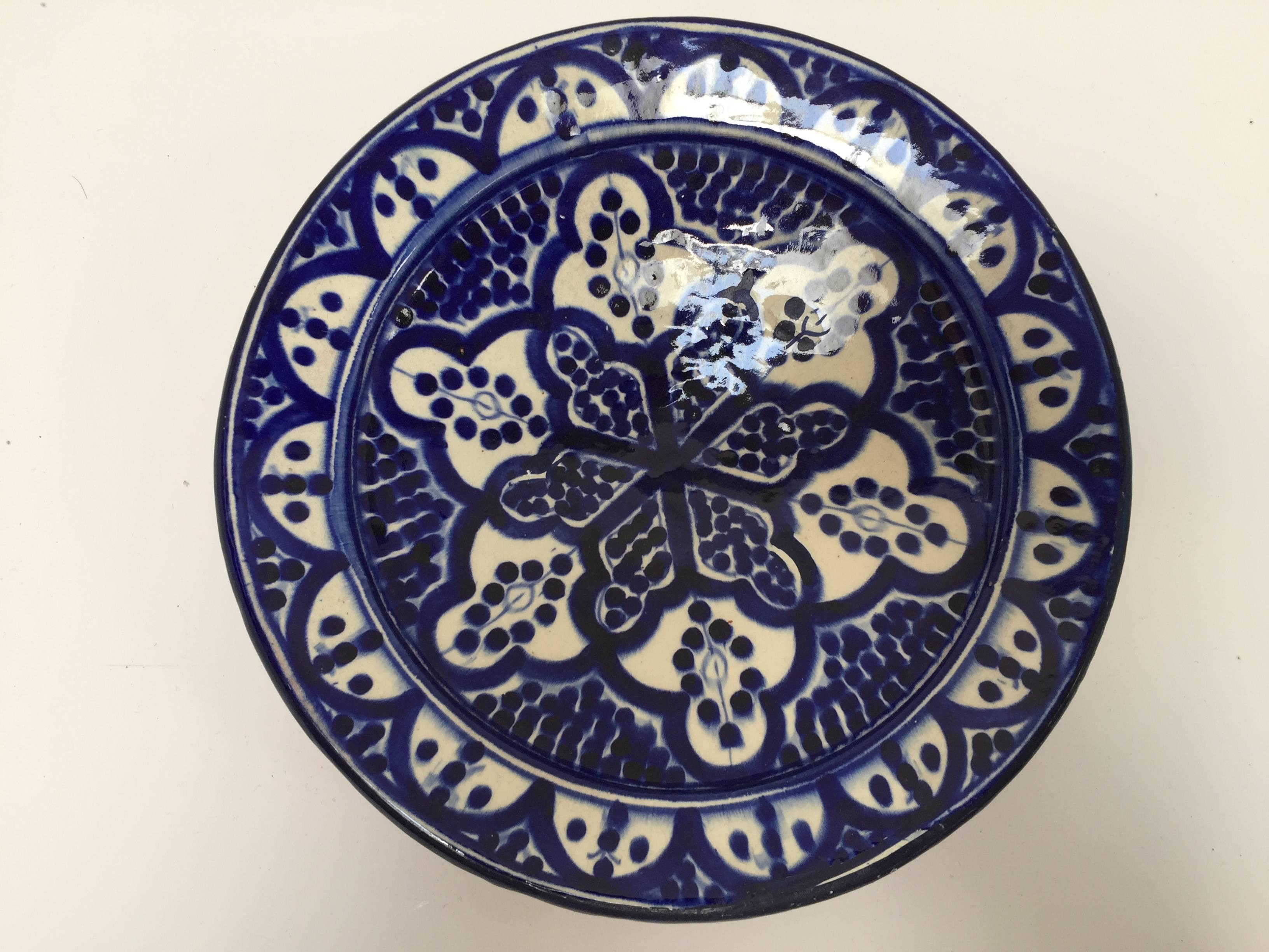 Moroccan handcrafted ceramic plate hand-painted in blue and white floral Moorish designs from Safi Morocco.
Could be hanging on the wall or used to display fruits.
Size: 10