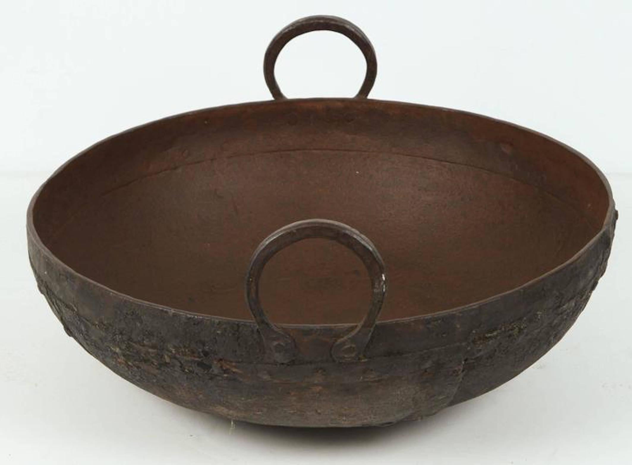 Large metal iron pot from Southern India known locally as an urli. 
These Pots were placed directly on a fire and large meals were prepared for special events. 
They make great garden ponds, jardinières and other outdoor uses. 
Hand-tooled detailing