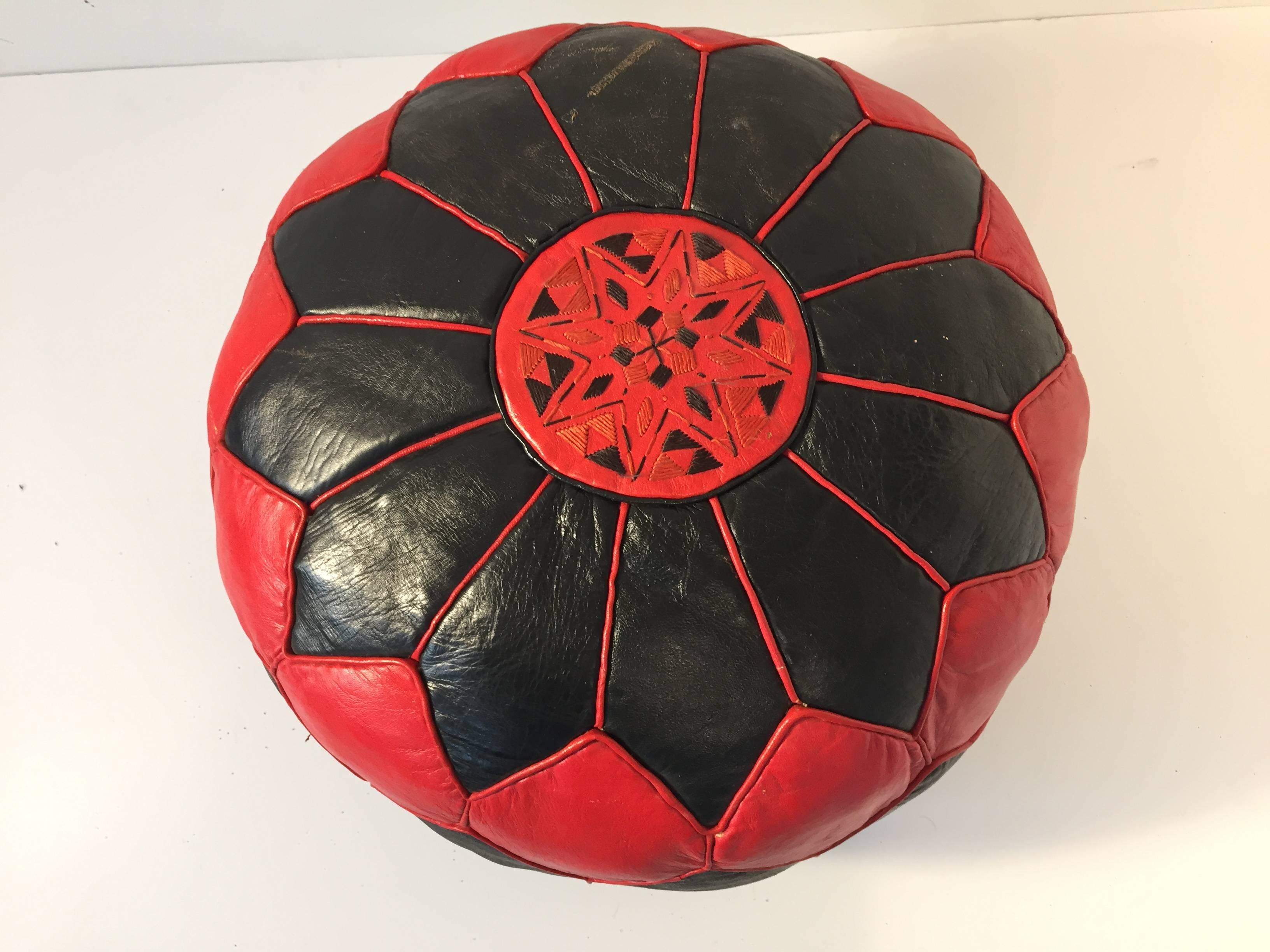 Moroccan red and black colors round leather pouf hand tooled and embroidered in Marrakesh, Morocco. 
Size is 20 in. diameter x 12 in. height.