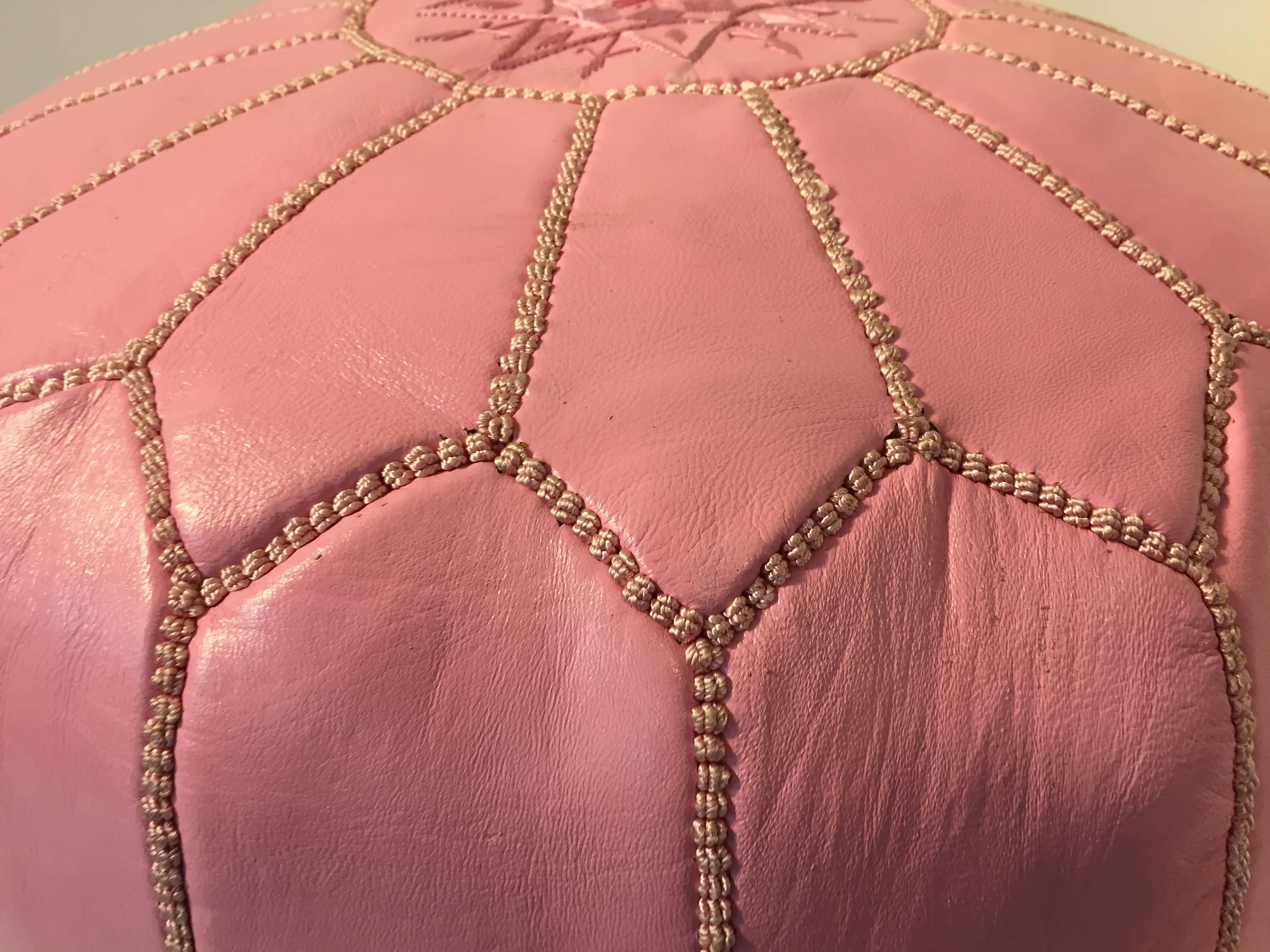 pink leather pouf