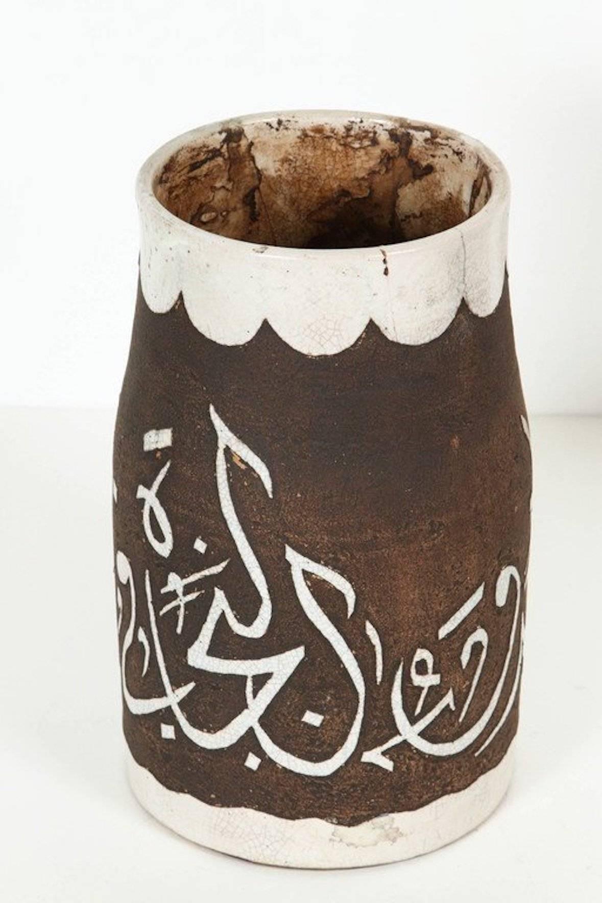 1940s Antique Brown and Ivory Hand-Crafted Moroccan Ceramic Vase.Very decorative chiseled small brown and ivory cor ceramic handcrafted by artisans in Fez Morocco.Hand-graved etched ceramic with ivory Arabic poetry calligraphy.Mouth opening is 5