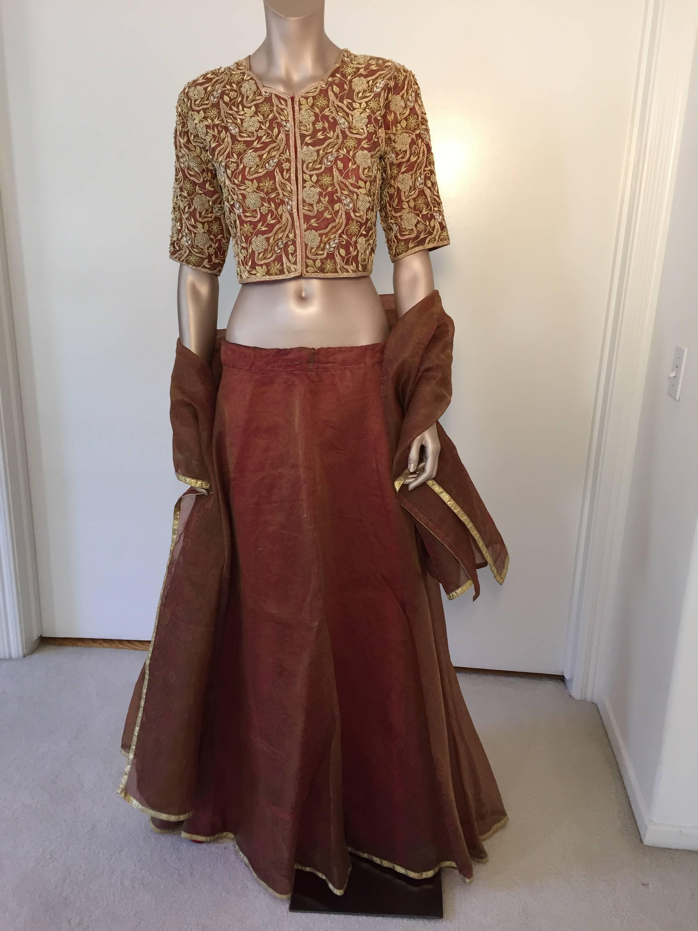 Amazing vintage Bollywood star silk sari custom designer beaded gown.
Classy brocade blouse embroidered with pearl and metallic threads with 
extensive bead work, appliqué and embellished with a veritable treasure Trove of sequins and beads with