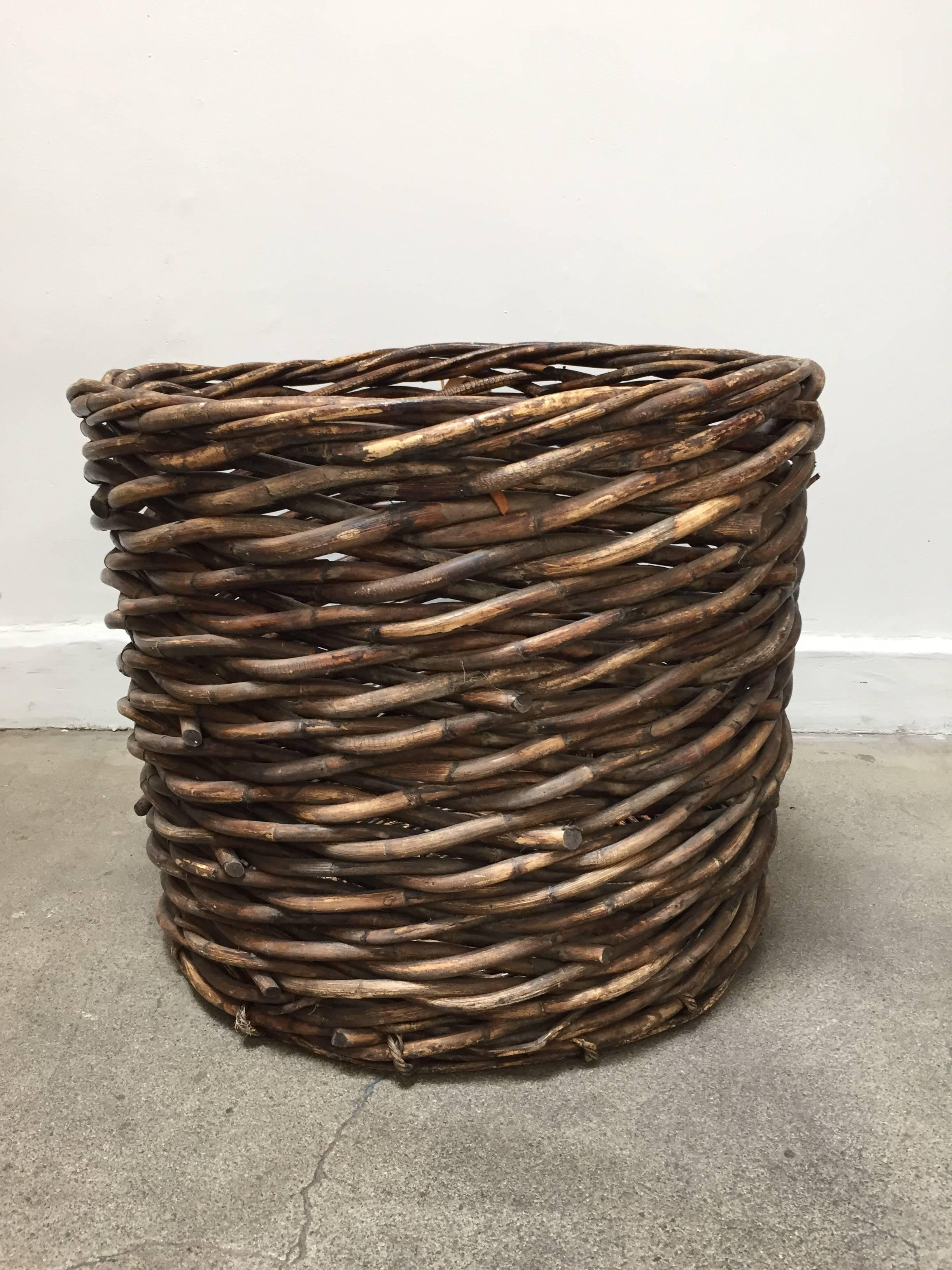 Large French vineyard harvest wicker basket.
Classic oversized French wicker basket.
Handmade and Handwoven of a thick wicker in superb condition and a lovely warm patina. 
Art and crafts rustic style for your country barn house.
Great as a