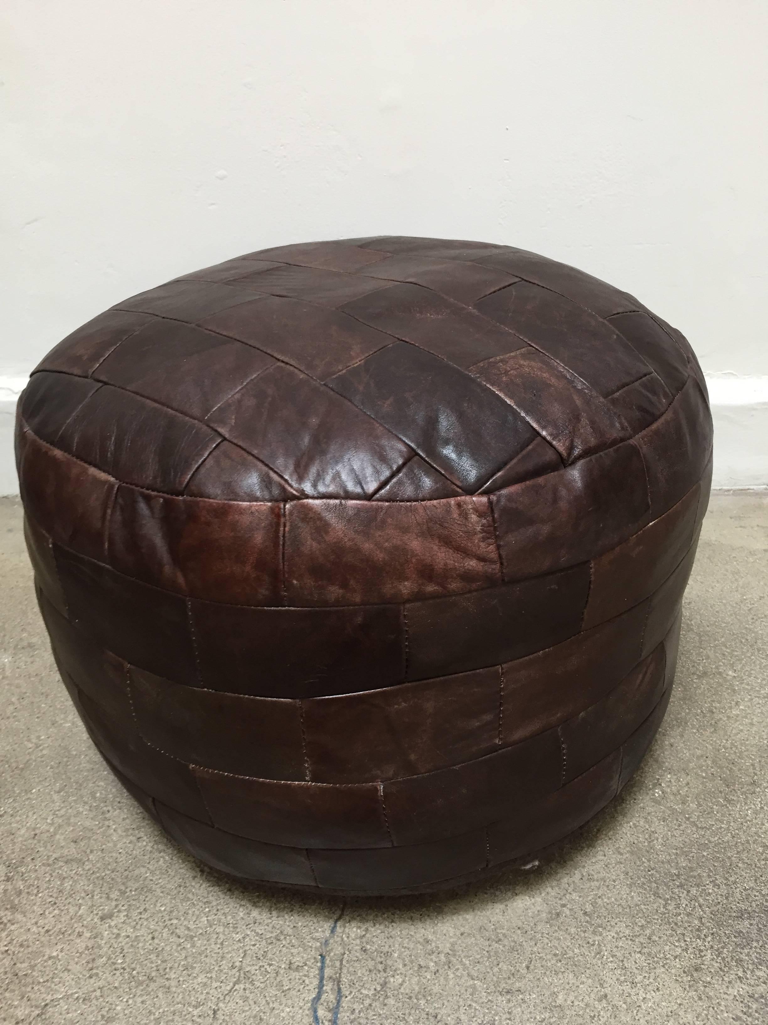 Gorgeous brown leather patchwork ottoman by De Sede.
Stitched leather pouf by De Sede, 1970s, Switzerland.
De Sede DS-80 Brown Patchwork Leather Pouf, Ottoman, 1970s, Switzerland.
Unique and decorative handmade De Sede DS-80 pouf from 1970s. 
The