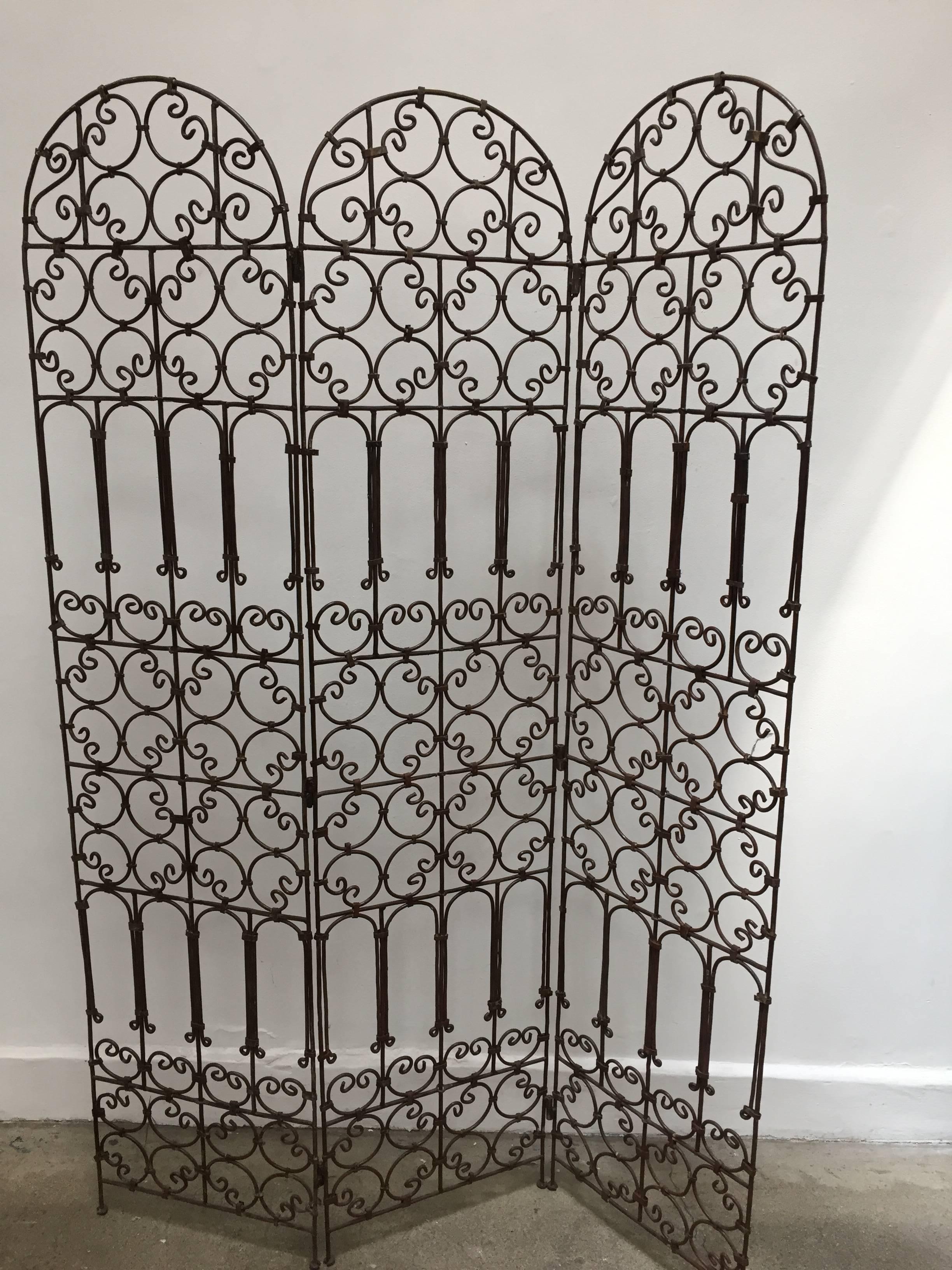 Hand-forged folding Moroccan screen with three panels decorated with Moorish designs.
Classic and elegant Art & Craft this highly embellished, detailed folding screen divider in the Mediterranean Spanish style would embellish any room, garden or