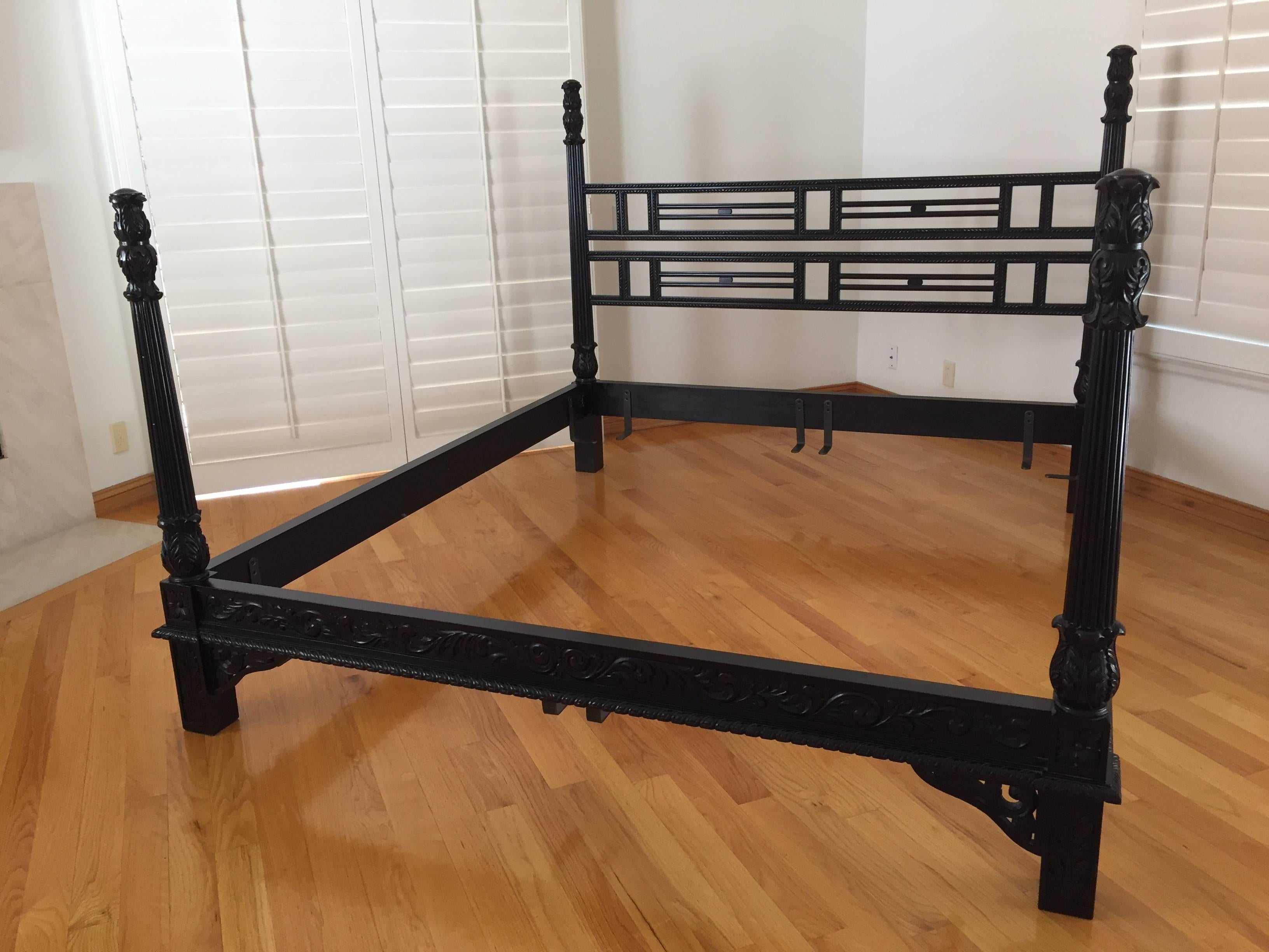 Highly carved four-poster king bed.
This bed is profusely carved on all posts, terminating in magnificent pineapples.
Anglo-Indian style, black painted ebonized look.
Overall size from outside:
92 in. x 80in.
Headbord poles 61in. H.
Foot board