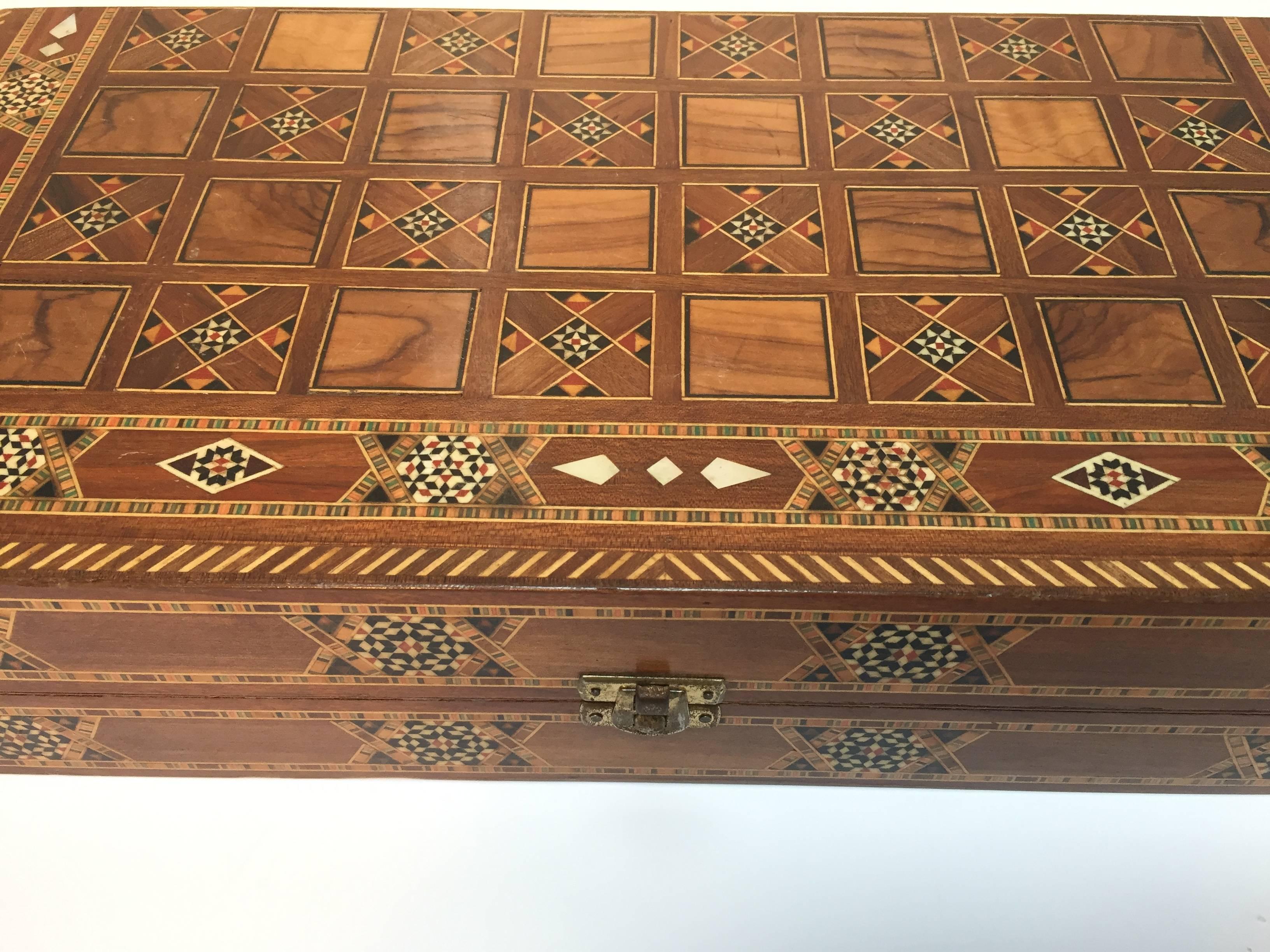Fine large Syrian inlaid marquetry mosaic backgammon and chess game box.
Amazing craftsmanship the intricate marquetry fruitwood in mosaic Moorish geometric pattern and mother-of-pearl inlay and fine precision makes it a true work of