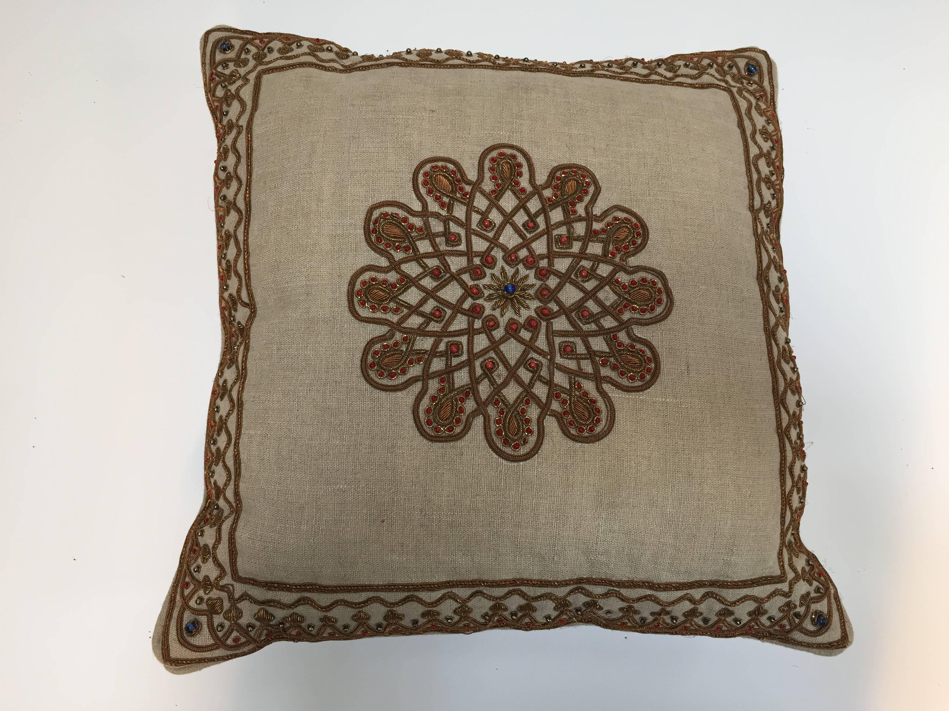 Throw decorative accent pillow embroidered with Moorish metallic threads embroidery on tan color linen.
Handcrafted pillow embellished with Turkish metallic threads embroidered onto linen and embellished with red beads.
Down inserts.