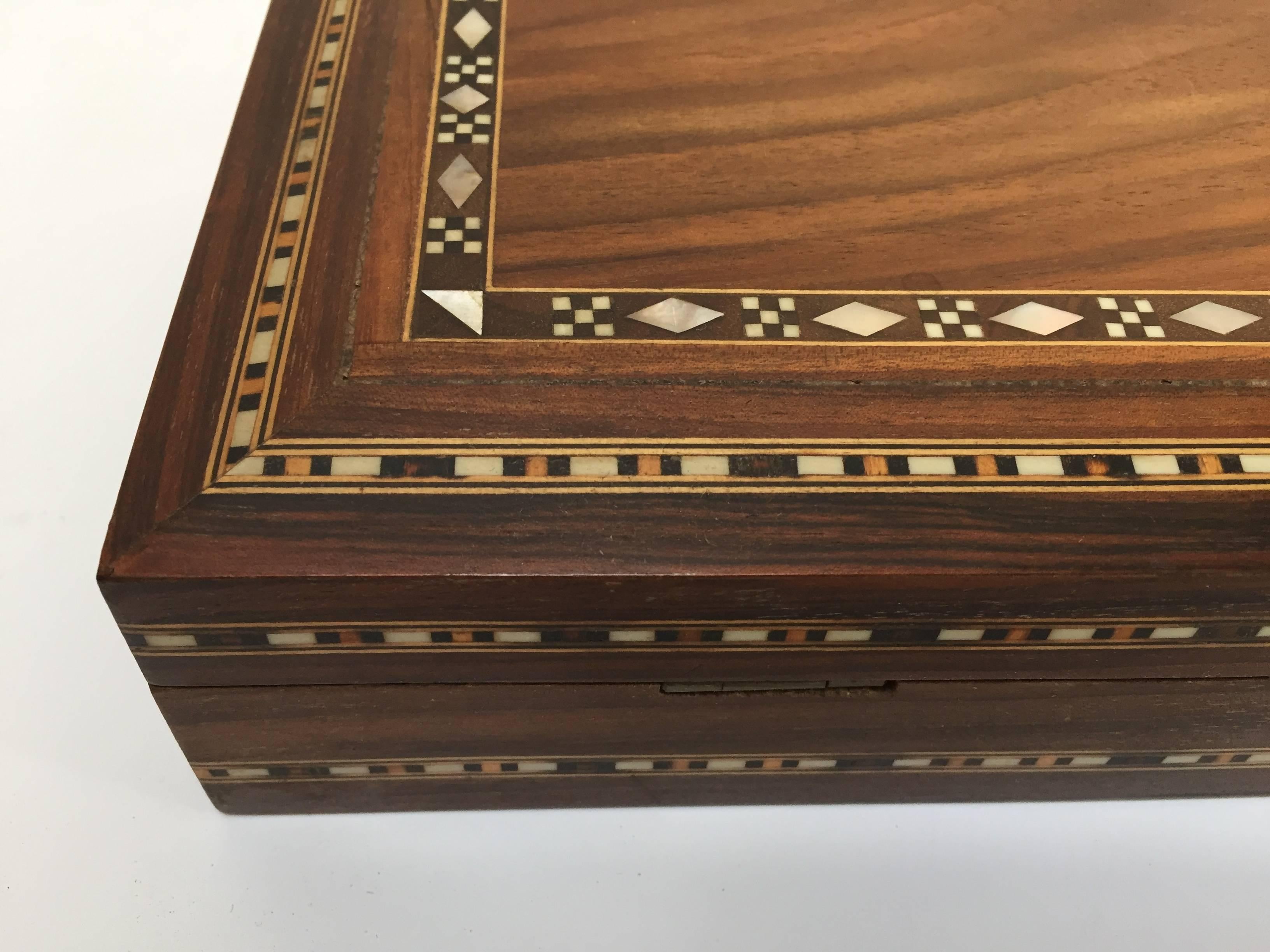 Large Middle Eastern  precious wood decorative box inlay with fruitwood and mother-of-pearl and lined with red velvet.
Very elegant and Classic handcrafted in Damascus Syria by skilled artisans, great jewelry or treasure box.
 