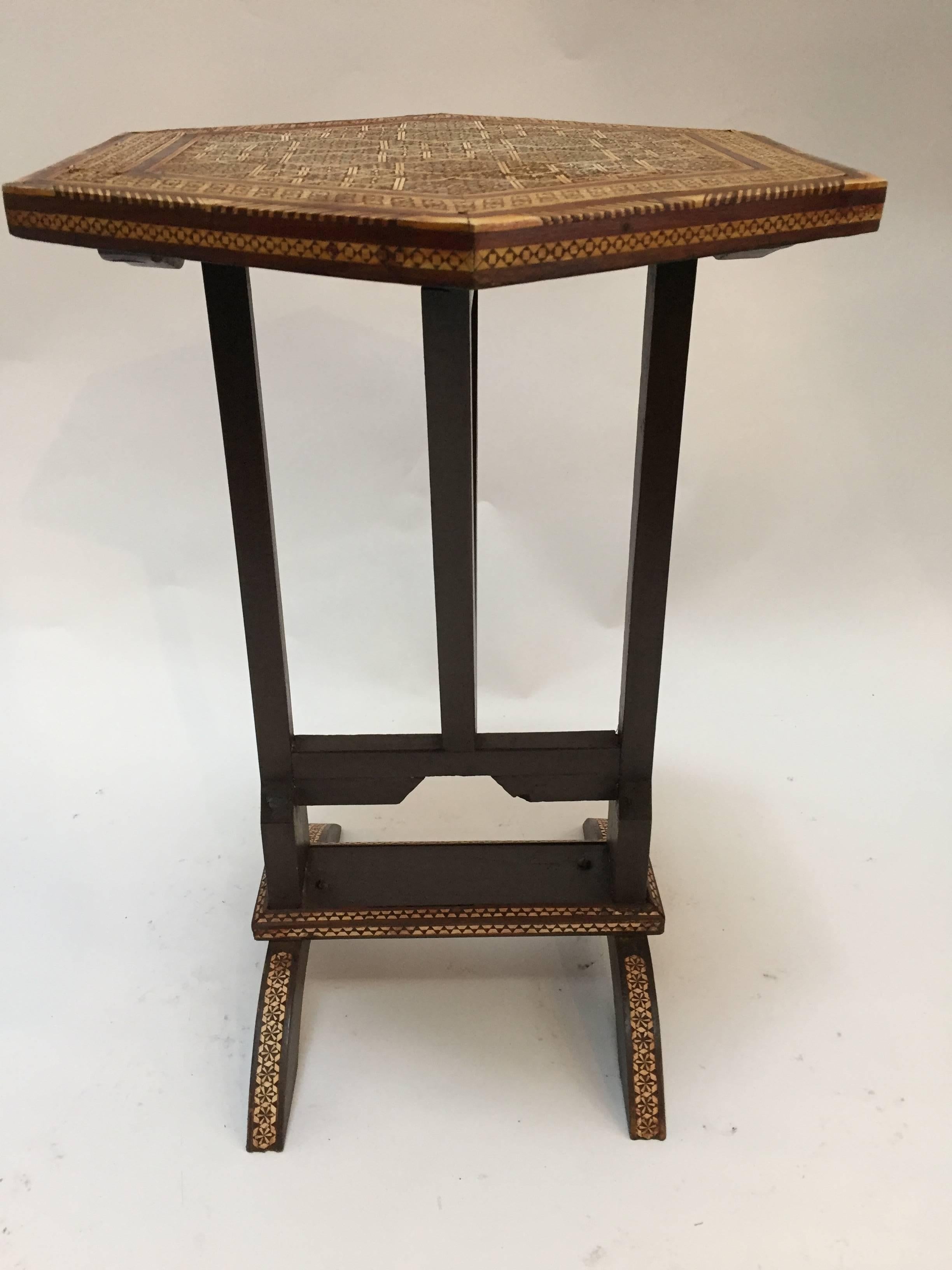 Middle Eastern Egyptian octagonal side table with marquetry inlaid and mother-of-pearl. 
Tilt-top table with Moorish intricate geometric designs.
Handcrafted by skilled artisans in Egypt.