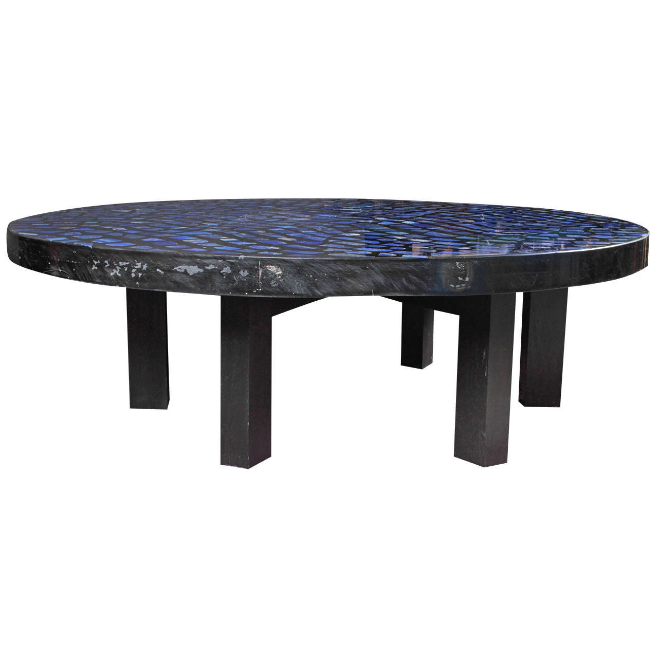 Very impressive Lapis Lazuli and resin circular coffee table by E. Allemeersch.
The table is peculiar by the shade of blues that varies and dances with the light.
The item is signed by the artist. 

Excellent condition.