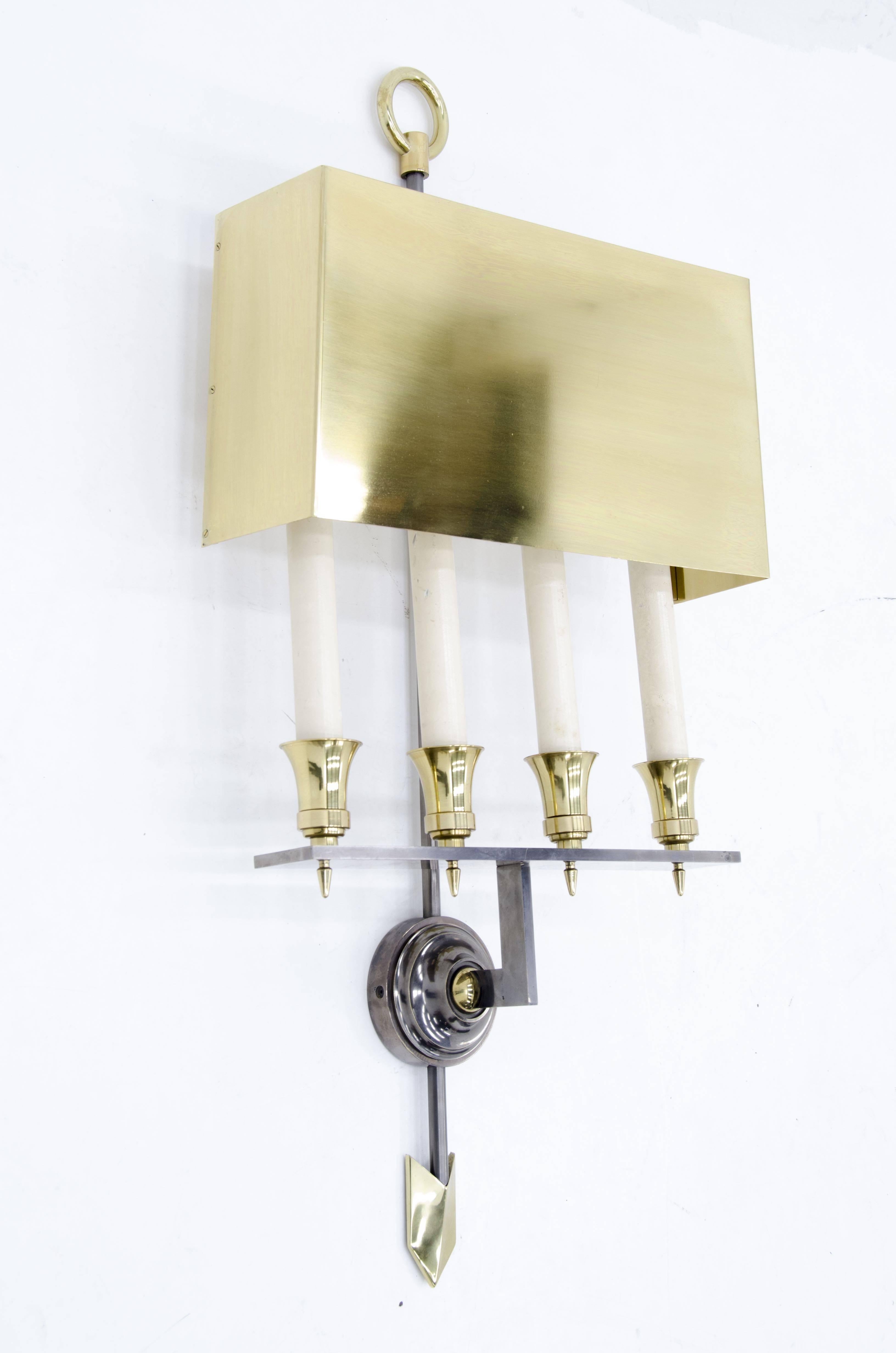 Pair of sconces by Gilbert Poillerat, circa 1960s in brass and steel (canon de fusil).