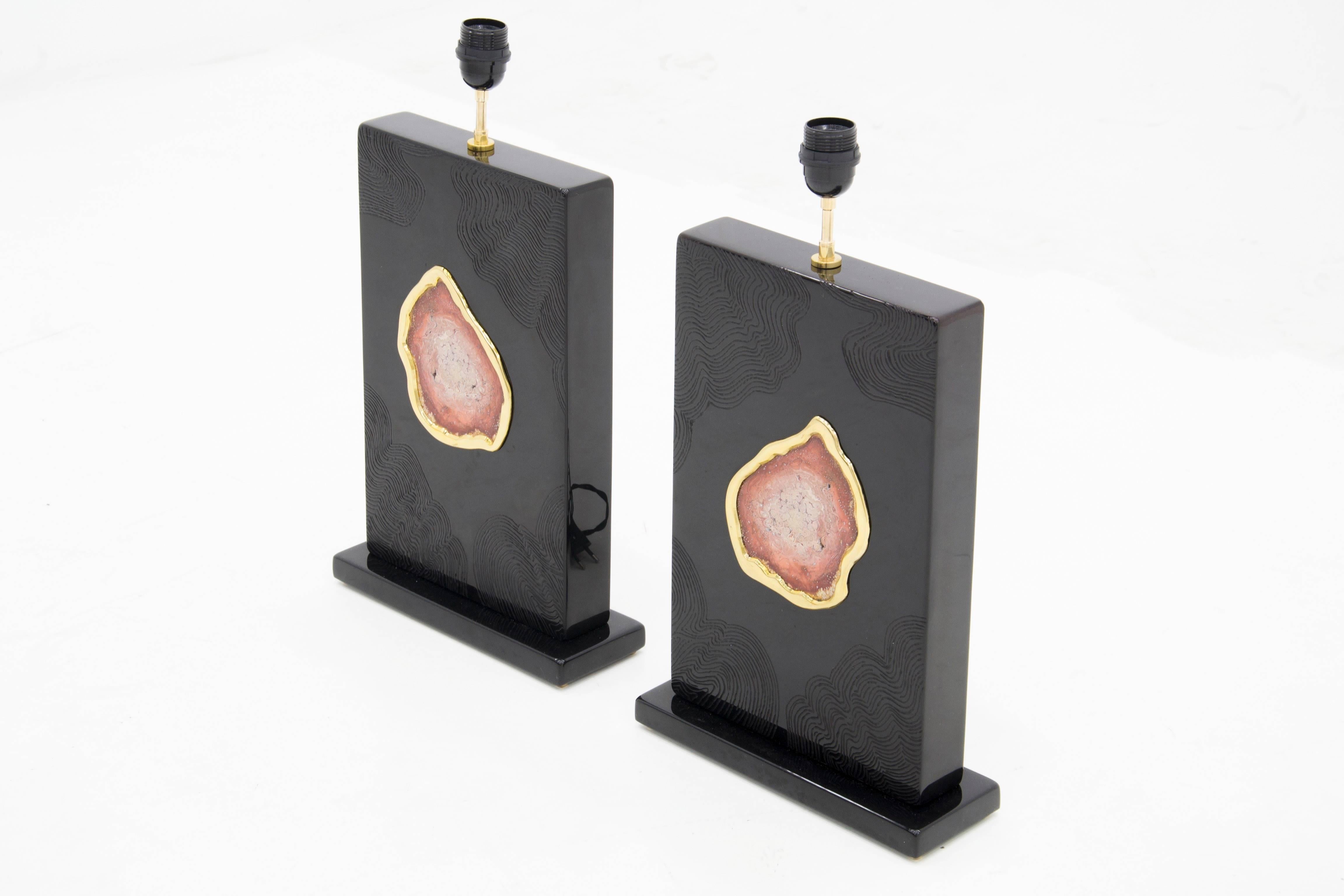 One of a kind studio built pair of lamps in black resin inlaid red stone by Stan Usel.
These pieces are made exclusively and distributed in USA for Saint Germain antiques. Exceptional craftsmanship. All pieces can be custom-made to order. Signed by
