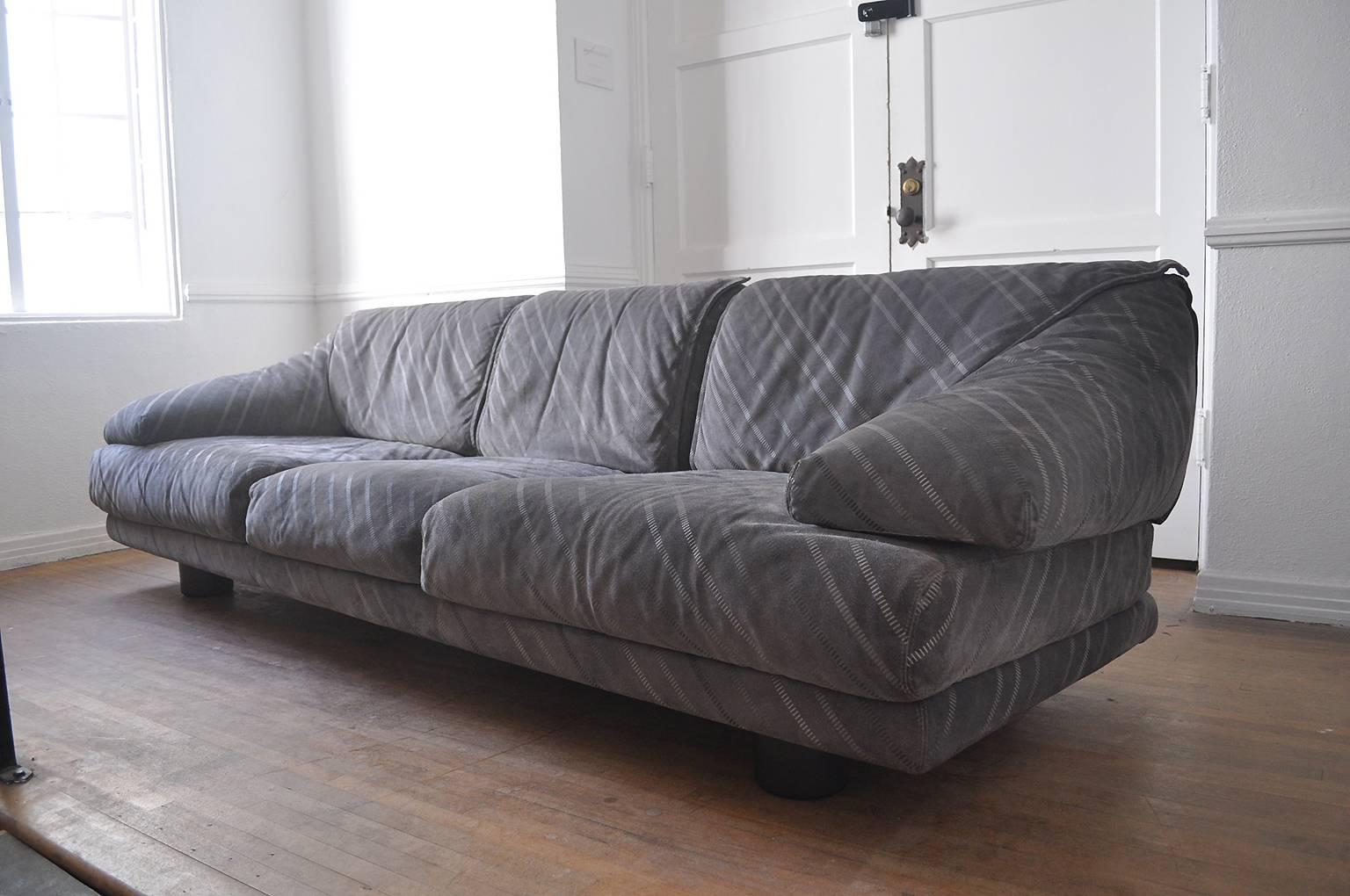 Saporiti Italia three-seat sofa in grey suede and black iconic cylindrical legs. Original manufacture labels attached.