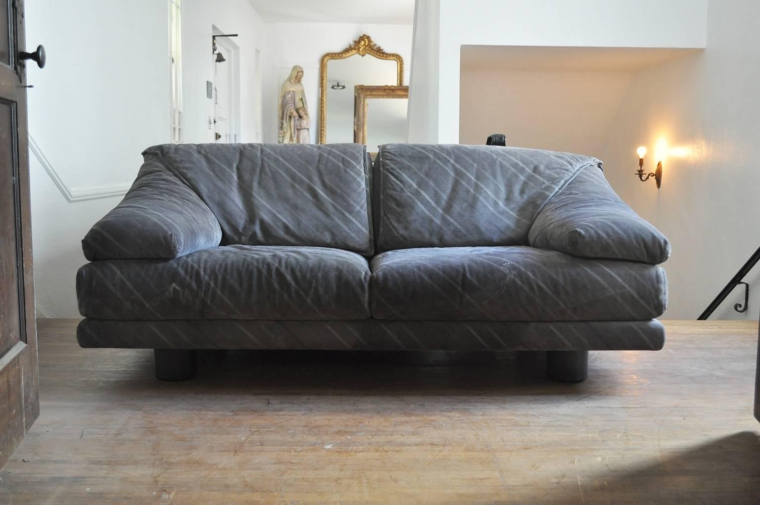 Saporiti Italia two-seat sofa in grey suede and black iconic cylindrical legs. Original manufacture labels attached.