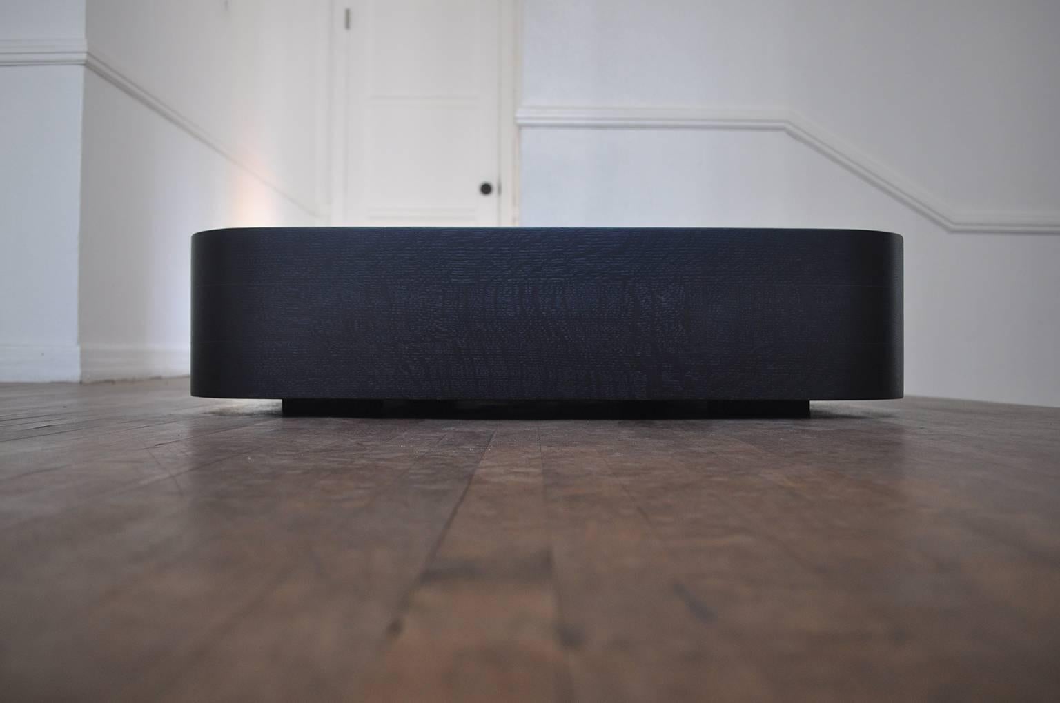 Low profile coffee table in ebonized oak with brown marble inset by Contempo Italia.