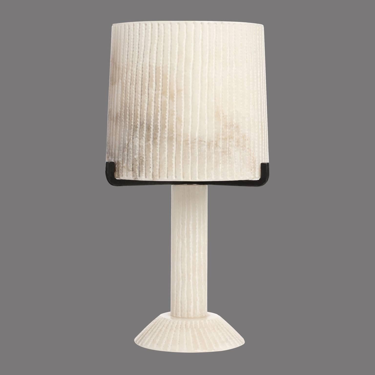 The Acropolis table lamp light consists of white alabaster with black steel details. Uses an E26 one x 60 W. 78.8” cord set with black flex and inline switch, supplied with two pin UL plug. No bulbs supplied. UL compliance for this lamp is $380